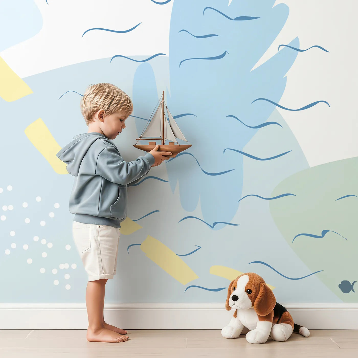 Child in front of Whimsy Tots Gentle Ocean Dream Wall Mural with whale, fish, starfish, ocean, sea, abstract, pastel, underwater in design.