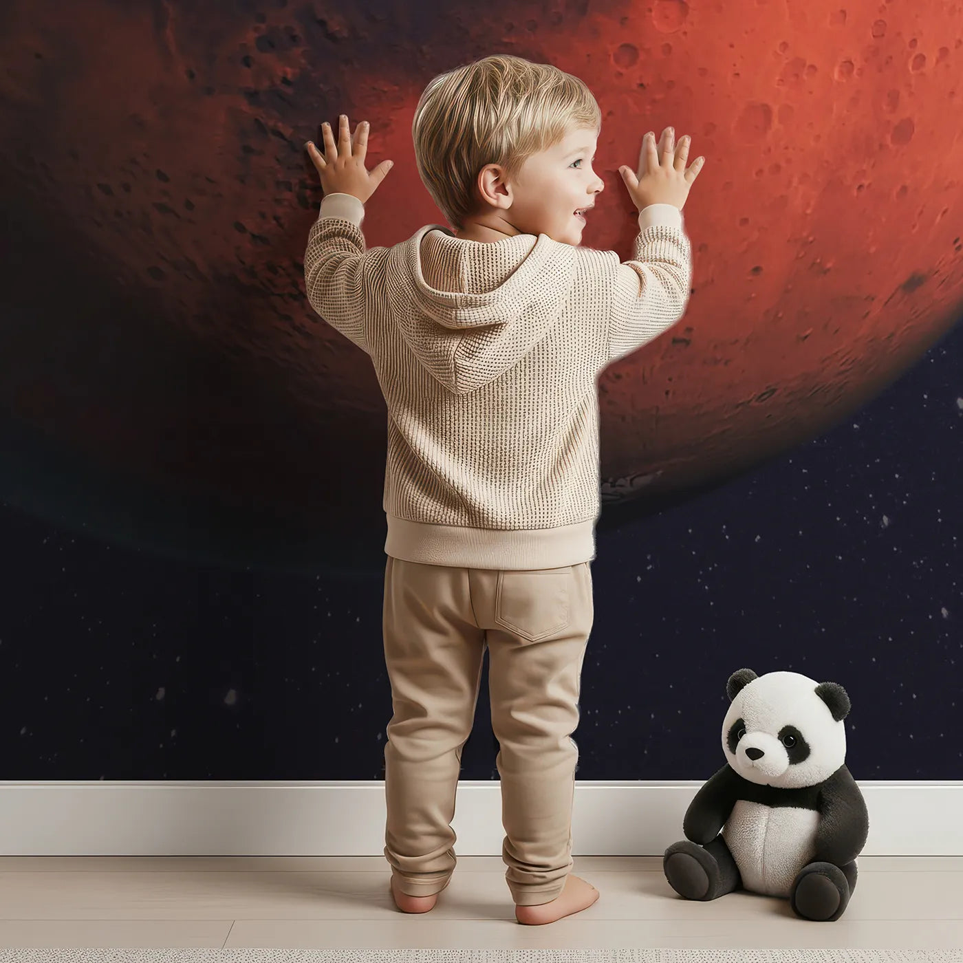 Child in front of Whimsy Tots The Planet Mars Wall Mural with mars, planet, space, solar system, science, astronaut, red planet in design.