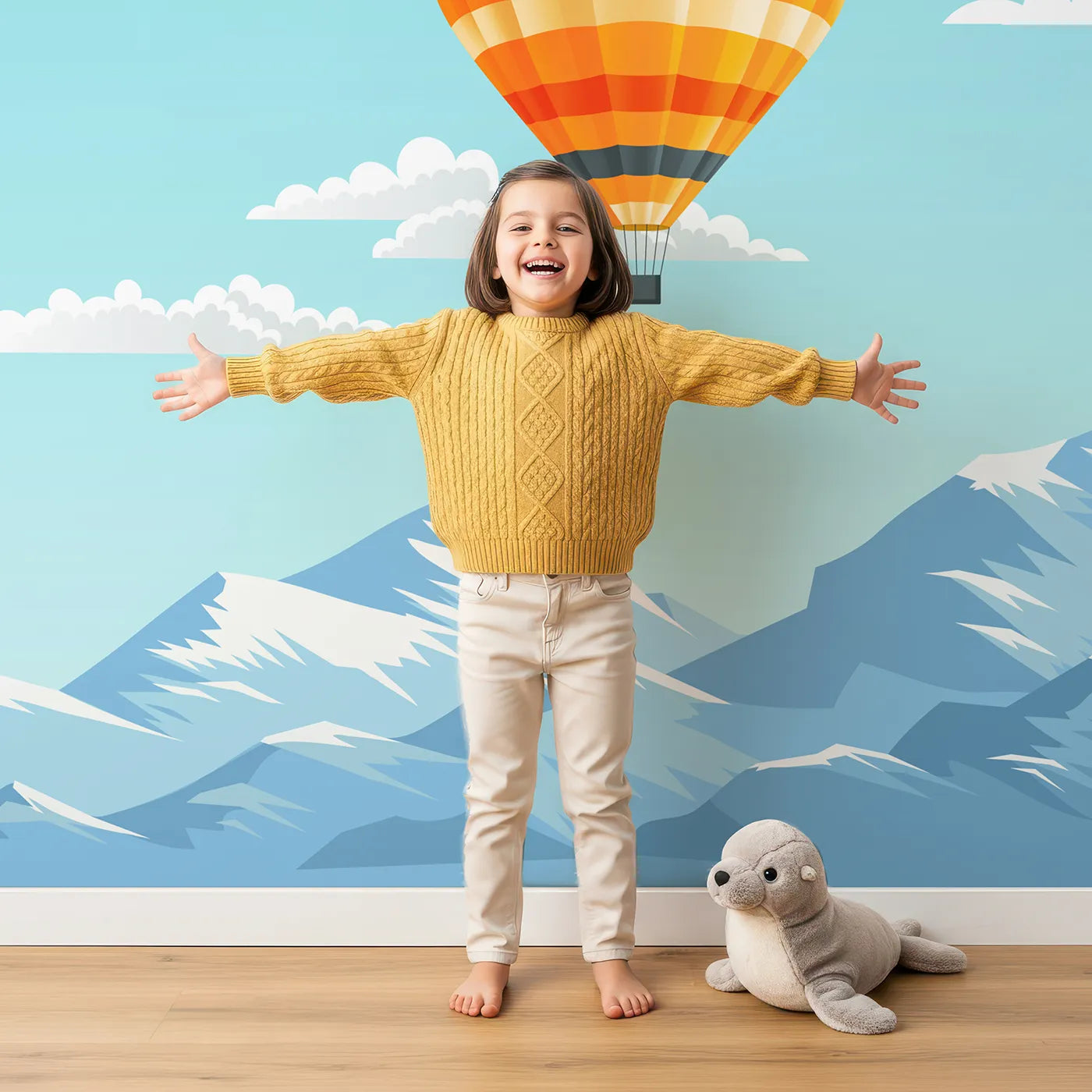 Child in front of Whimsy Tots Mountain High Balloons Wall Mural with hot air balloon, mountain, sky, cloud, sun, fly, adventure, landscape in design.