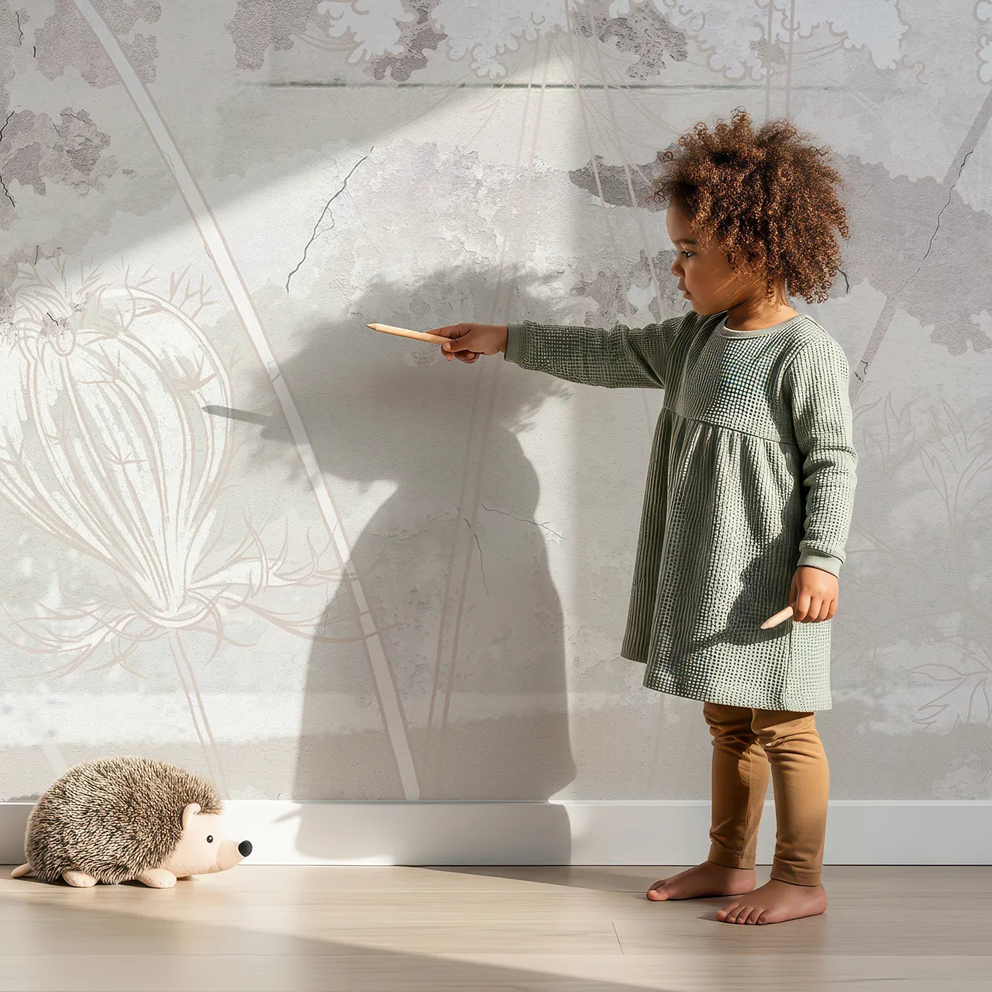Child in front of Whimsy Tots Abstract Floral Sketch Wall Mural with flower, abstract, sketch, floral, beige, gray, vintage, soft in design.