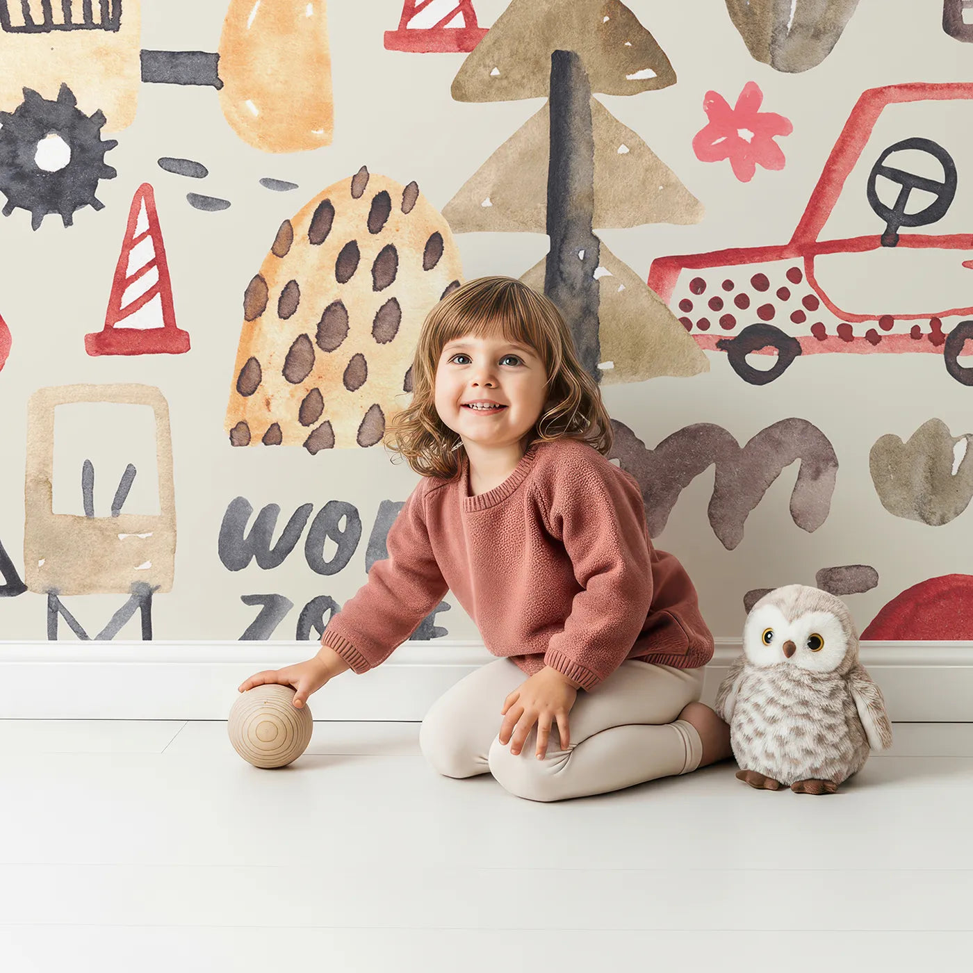 Child in front of Whimsy Tots Watercolor Work Zone Wall Mural with truck, car, construction, watercolor, work zone, taxi, cement mixer, tree in design.