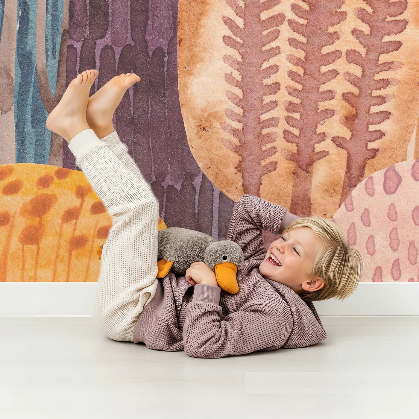 Child in front of Whimsy Tots Abstract Autumn Woods Wall Mural with forest, autumn, abstract, tree, watercolor, orange, red, woods in design.