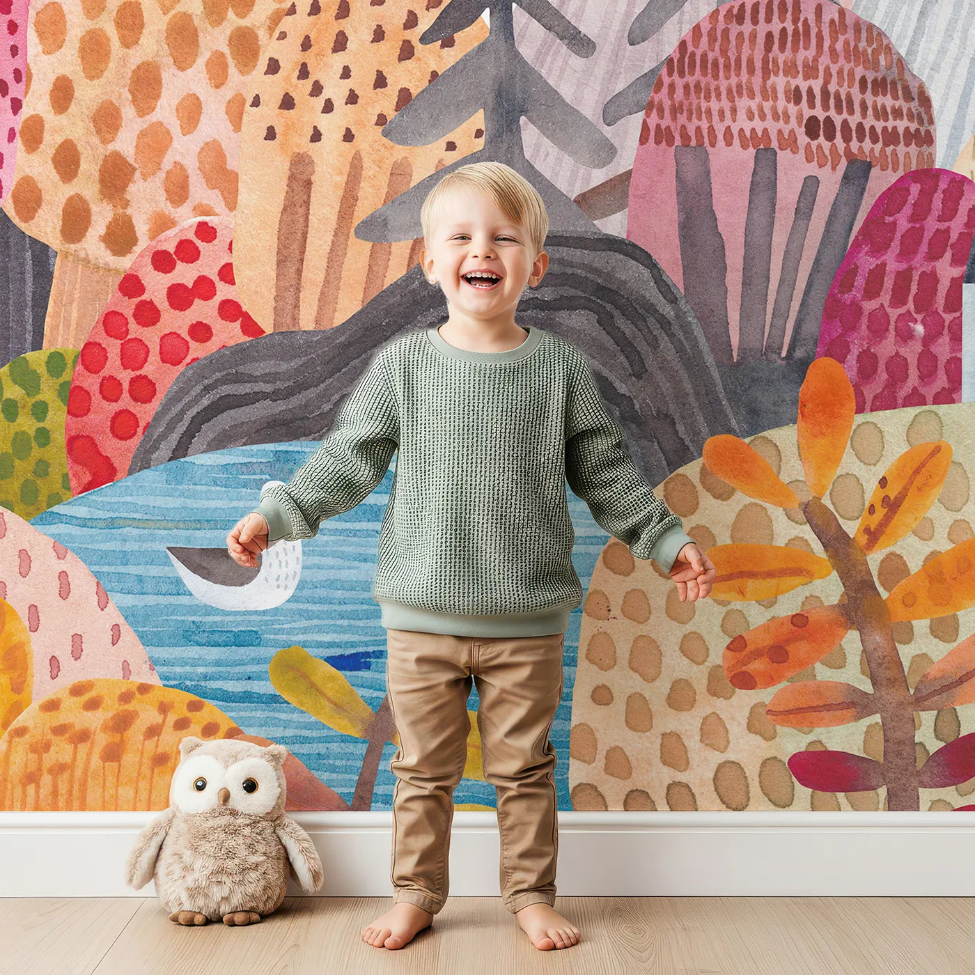 Child in front of Whimsy Tots Whimsical Mountain Lookout Wall Mural with landscape, mountain, bear, volcano, fantasy, watercolor, whimsical, adventure in design.
