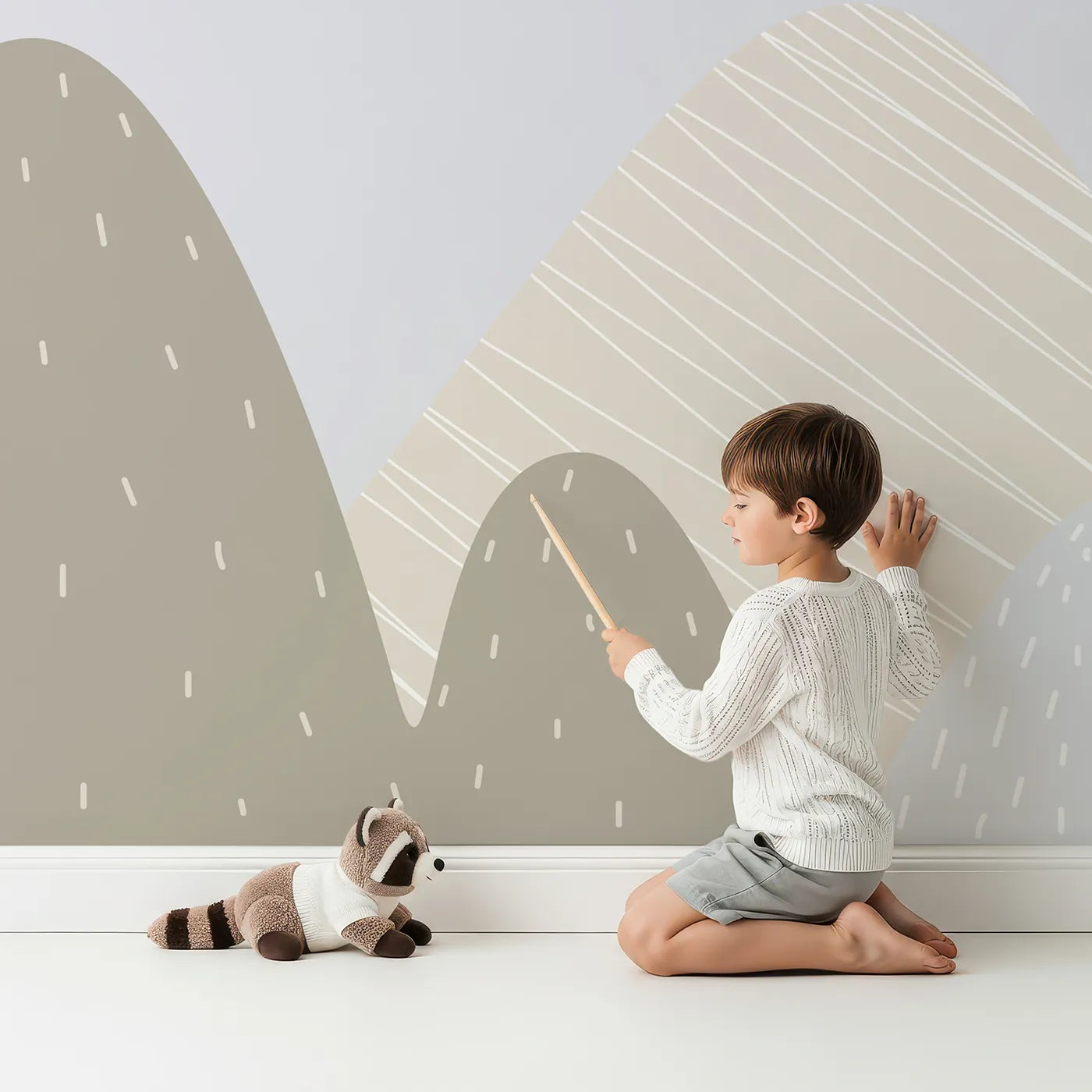 Child in front of Whimsy Tots Scandinavian Sky Fleet Wall Mural with airplane, balloon, helicopter, mountain, scandinavian, modern, gray, blue in design.