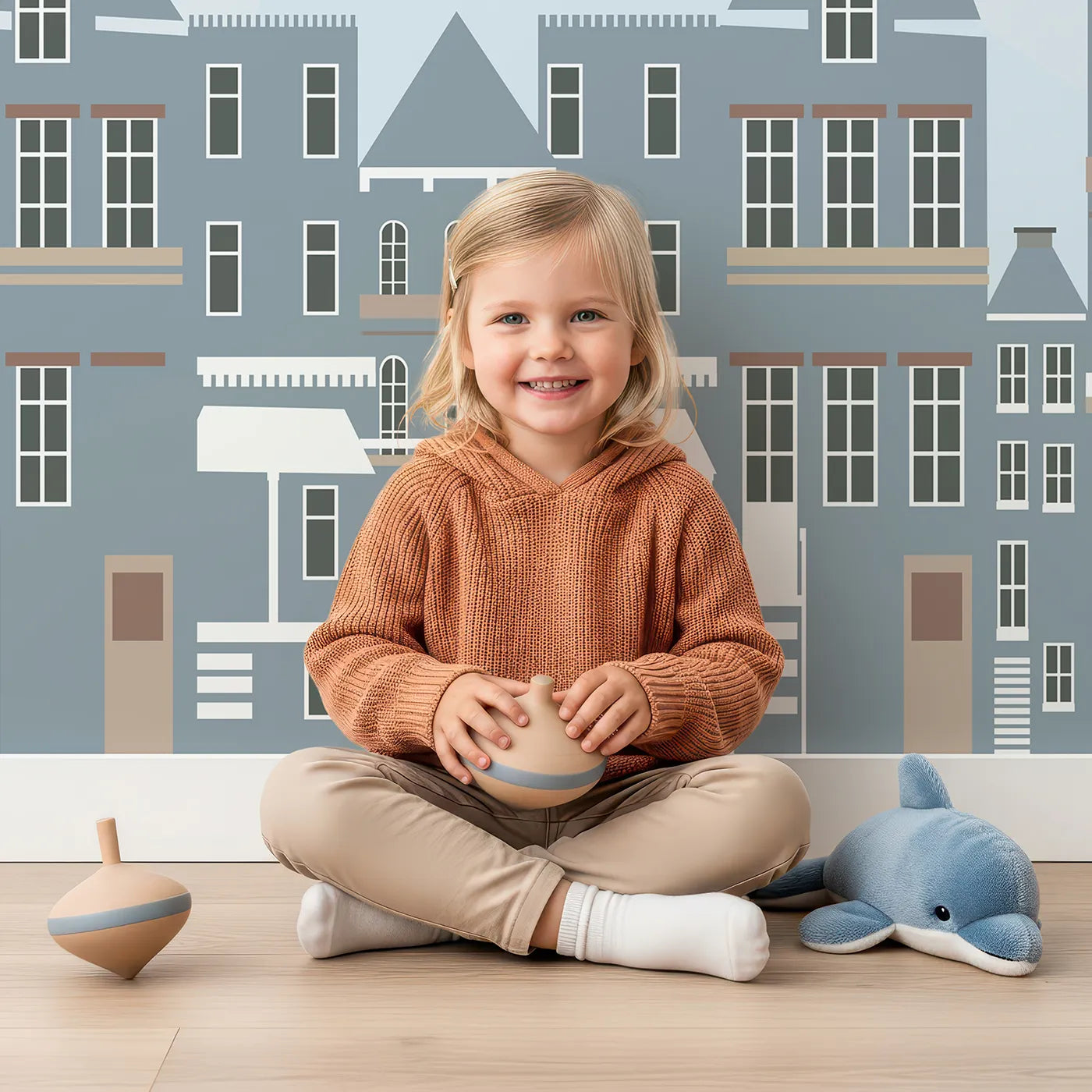 Child in front of Whimsy Tots Vintage Planes Over Town Wall Mural with airplane, vintage, town, city, biplane, retro, europe, house in design.