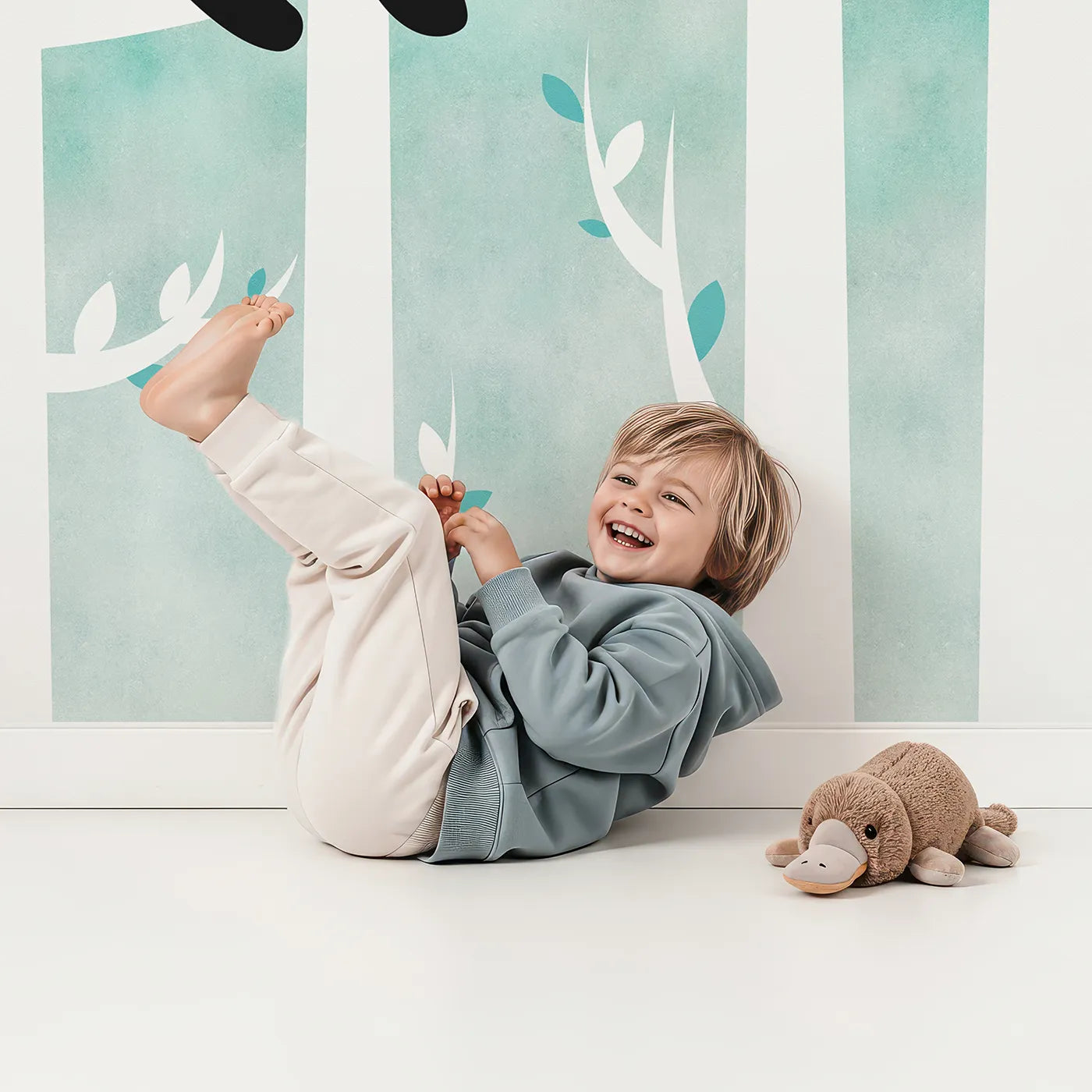 Child in front of Whimsy Tots Panda Birch Forest Wall Mural with panda, forest, tree, birch, teal, cute, animal, modern in design.