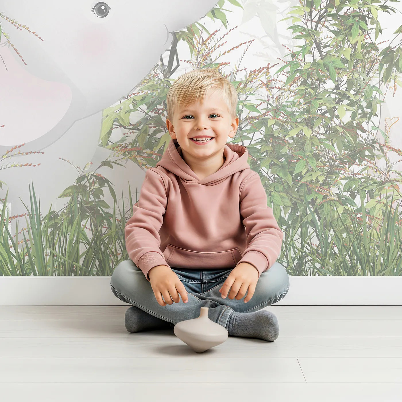 Child in front of Whimsy Tots Jungle Thicket Wall Mural with safari, jungle, animal, cute, leaf, green, hide and seek, thicket in design.