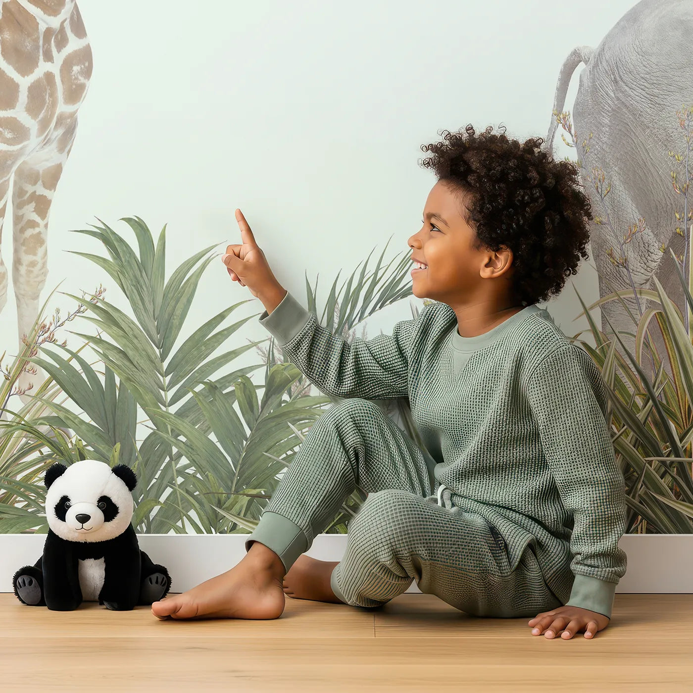 Child in front of Whimsy Tots Realistic Safari Stroll Wall Mural with safari, animal, jungle, realistic, elephant, giraffe, tiger, zebra in design.