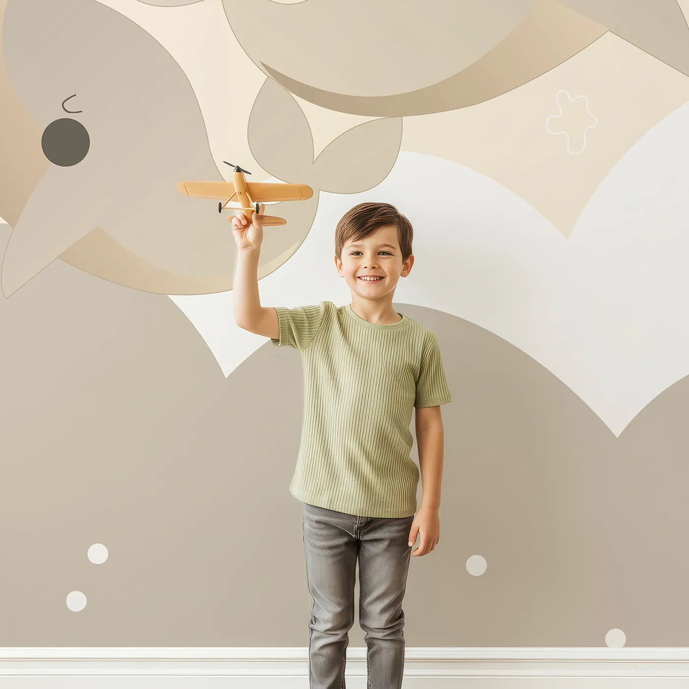 Child in front of Whimsy Tots Flying Whale Family Wall Mural with whale, flying, cloud, sky, cute, neutral, beige, nursery in design.