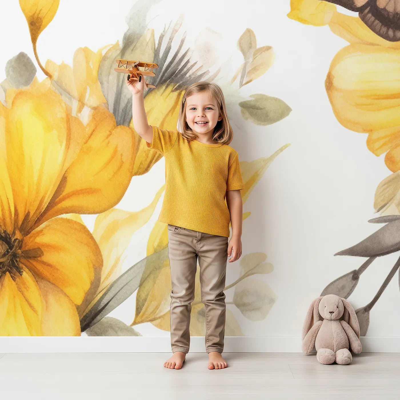 Child in front of Whimsy Tots Yellow Butterfly Meadow Wall Mural with butterfly, flower, yellow, watercolor, floral, gentle, calm, nature in design.