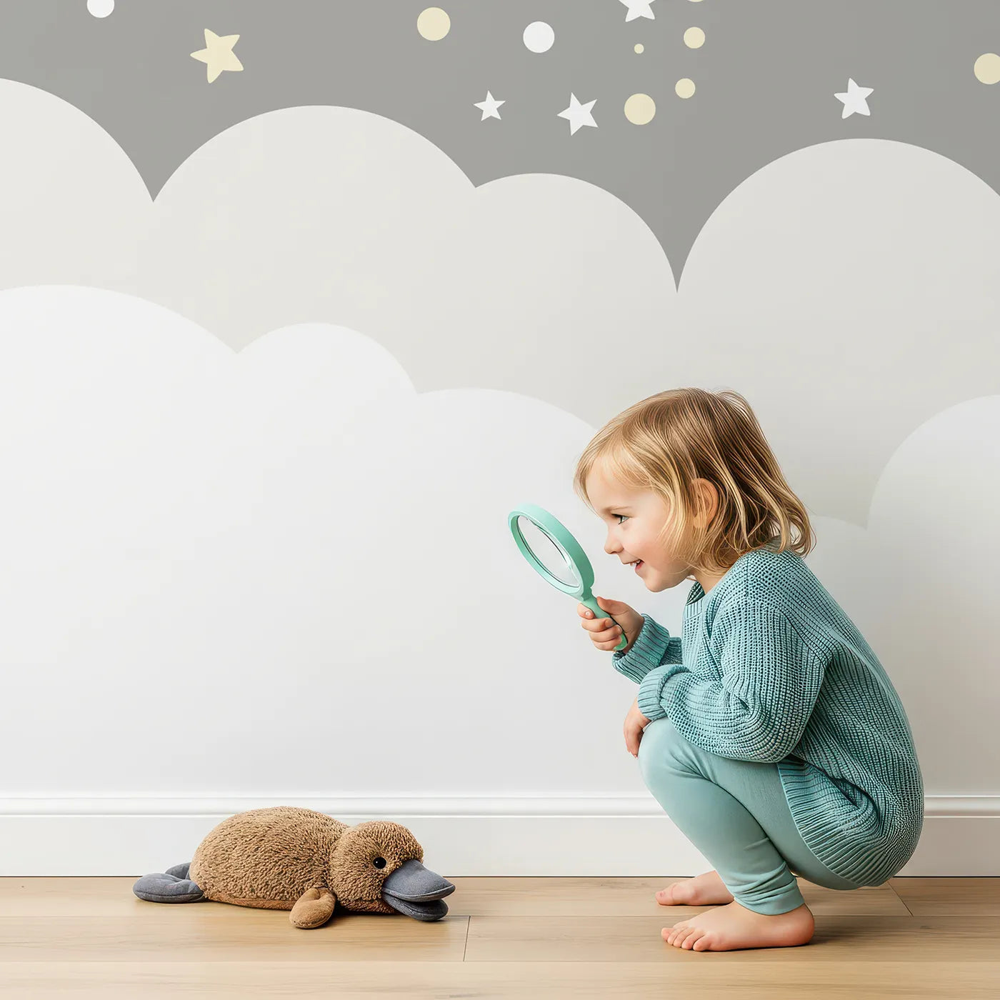 Child in front of Whimsy Tots Sleepy Moon and Stars Wall Mural with moon, star, space, sleep, cute, gray, nursery, planet in design.