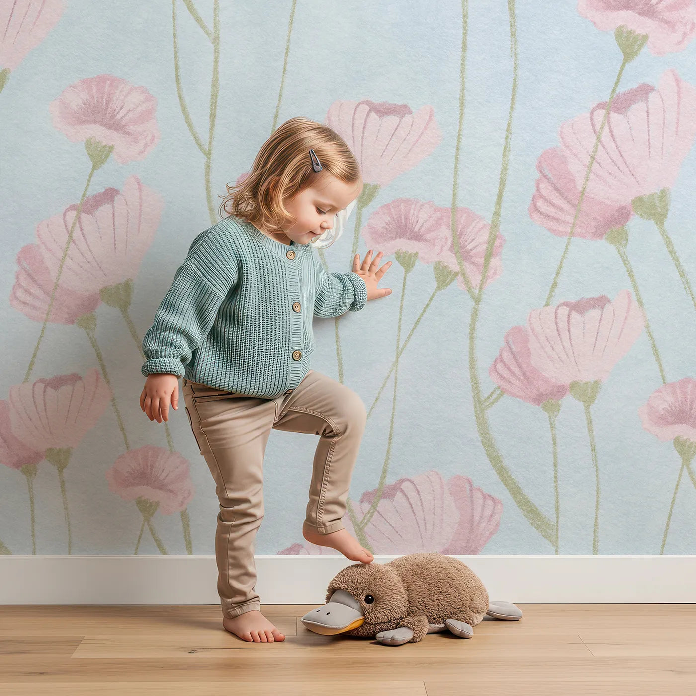 Child in front of Whimsy Tots Pink Wildflower Field Wall Mural with flower, wildflower, pink, painterly, floral, garden, blue, romantic in design.