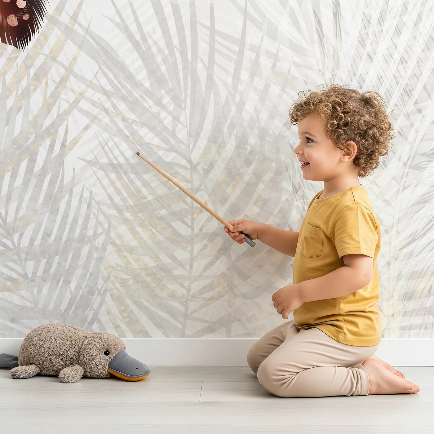 Child in front of Whimsy Tots Falling Feathers Wall Mural with feather, colorful, falling, abstract, modern, rainbow, soft, gentle in design.