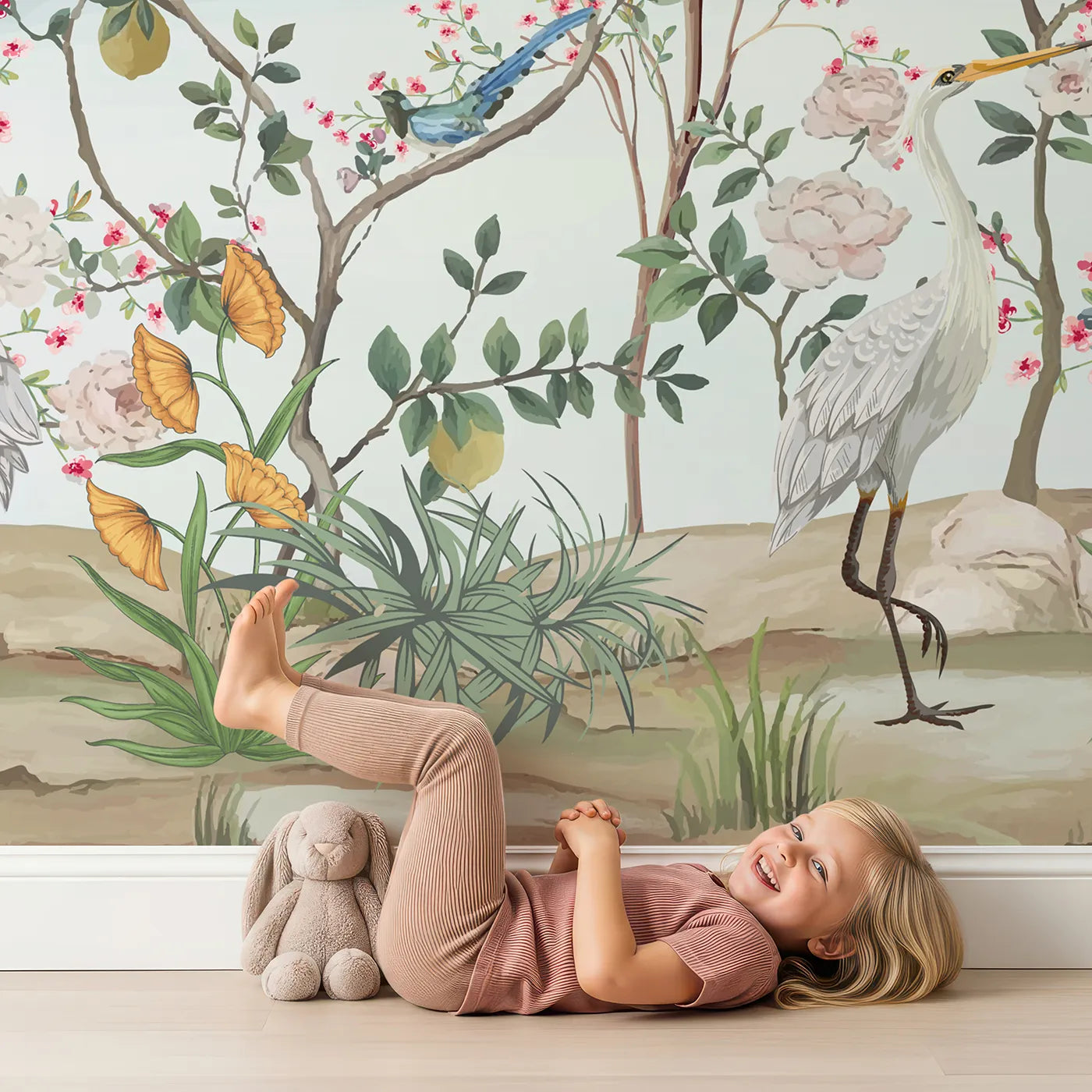 Child in front of Whimsy Tots Chinoiserie Paradise Wall Mural with chinoiserie, vintage, floral, flower, bird, peacock, blue, classic in design.