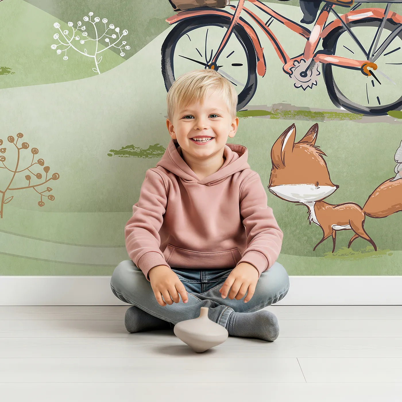 Child in front of Whimsy Tots Panda on a Bike Wall Mural with panda, bicycle, cute, animal, woodland, fox, rabbit, green in design.
