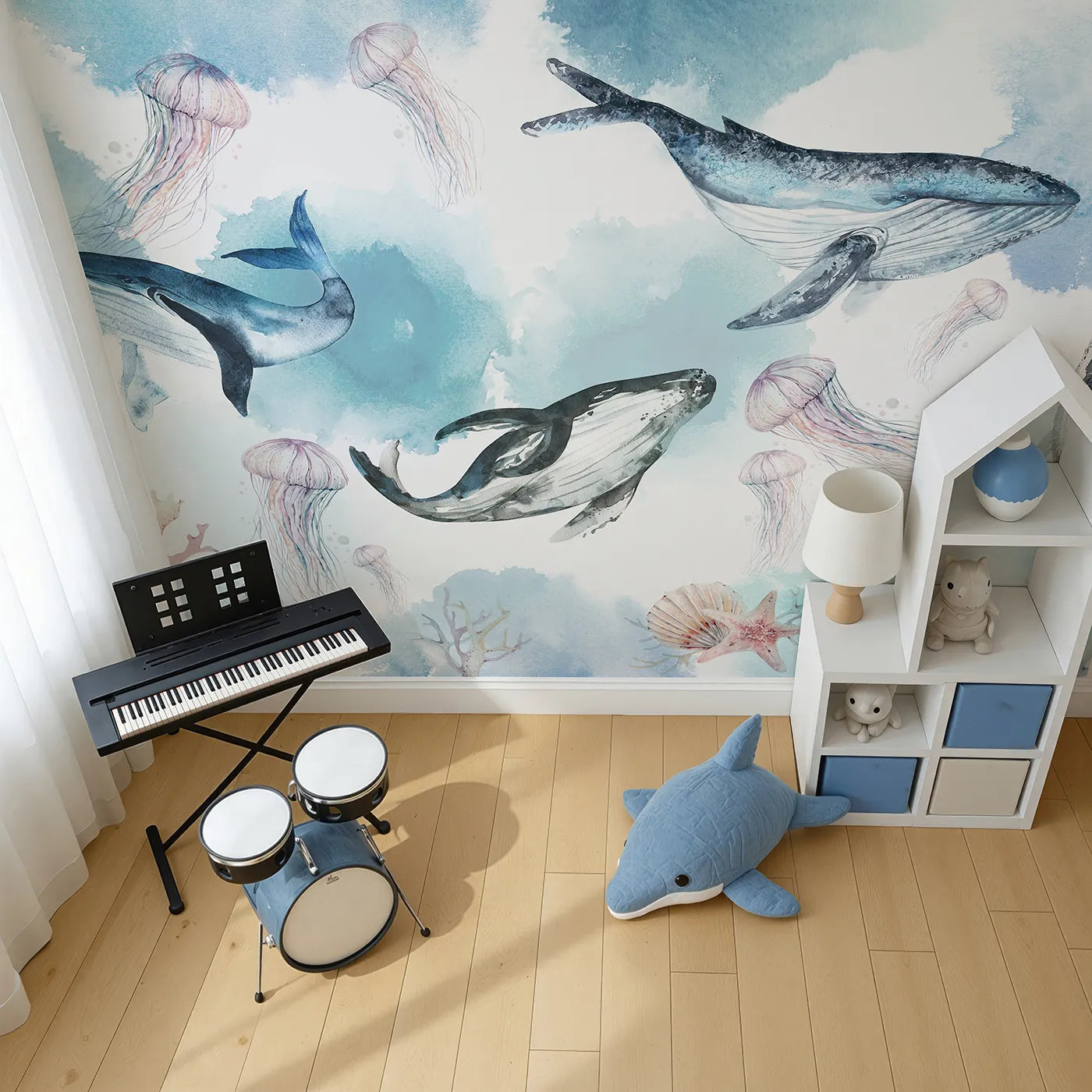 Top-down view of Whimsy Tots' Watercolor Whale Family Wall Mural (Turn Their Room into a Dreamy, Ethereal Ocean).Gender-Neutral