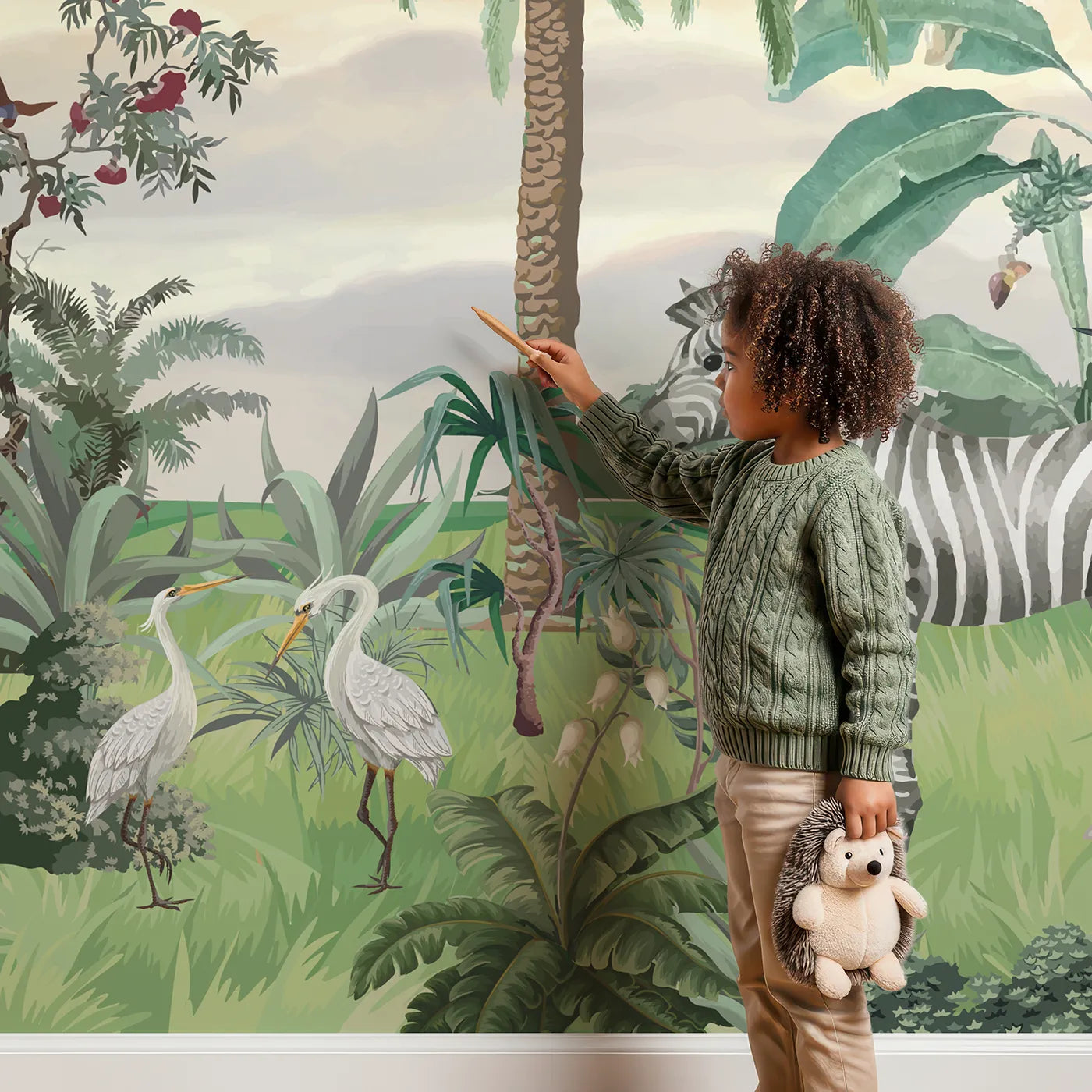 Child in front of Whimsy Tots Sunset Safari Wall Mural with safari, jungle, sunset, animal, giraffe, zebra, vintage, tropical in design.