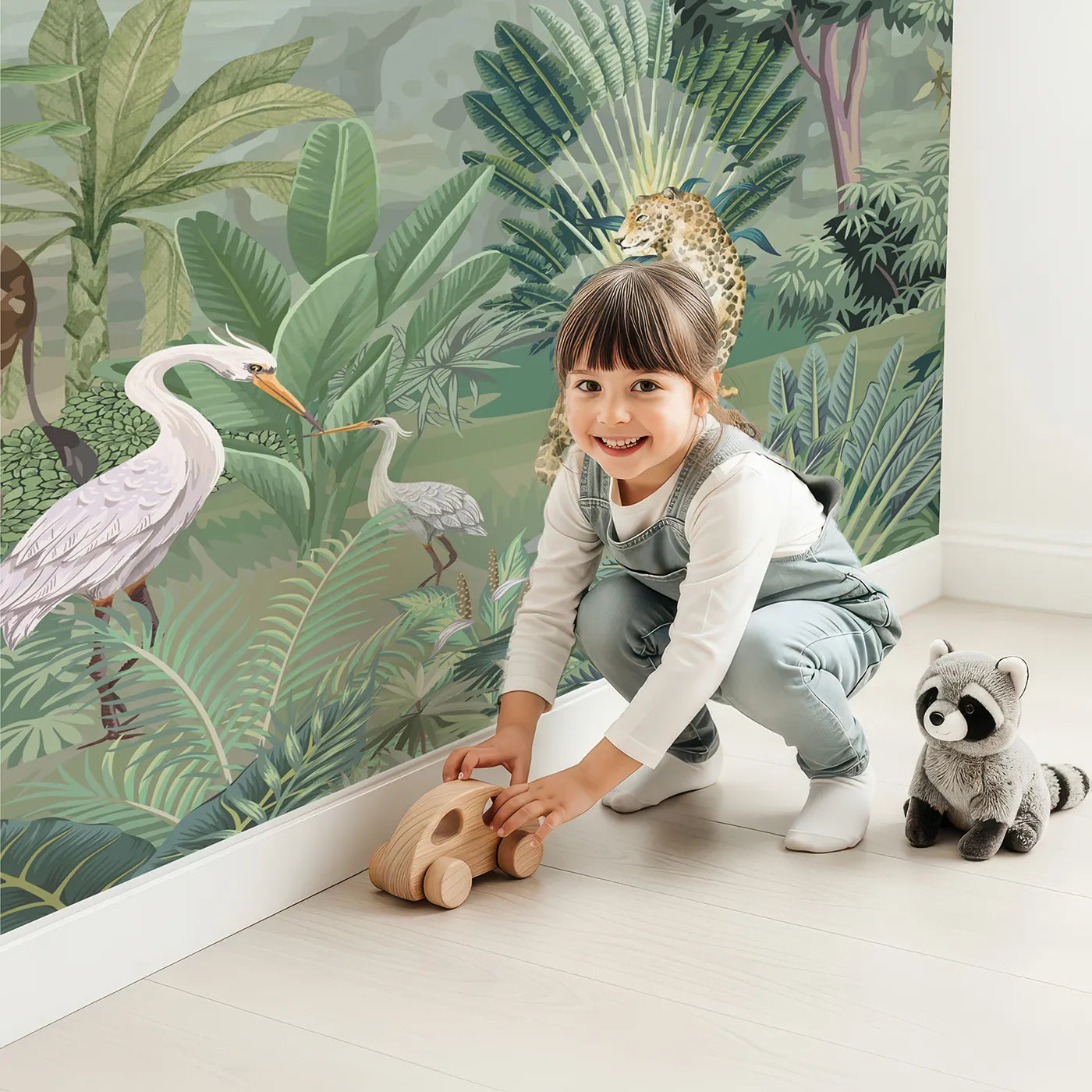 Child in front of Whimsy Tots Jungle Gathering Wall Mural in Green and Brown with safari, jungle, animal, realistic, elephant, giraffe, zebra, green in design.