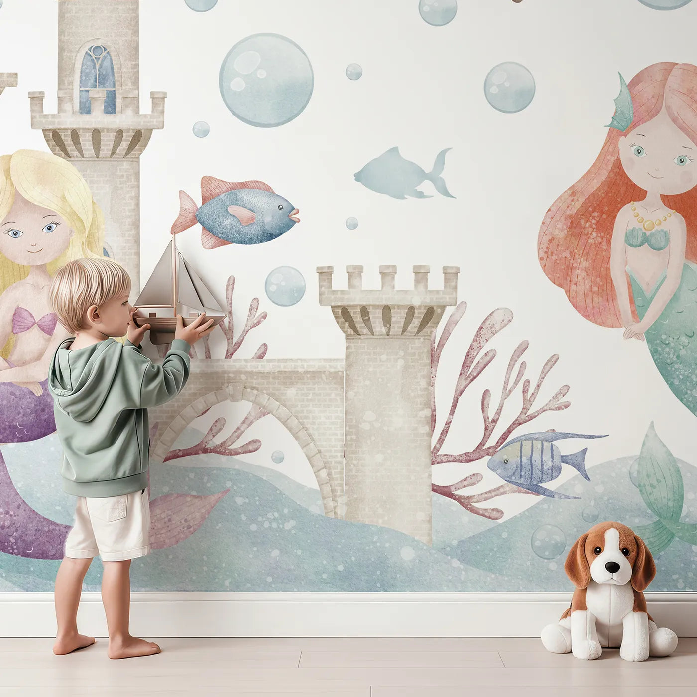 Child in front of Whimsy Tots Mermaid Kingdom Wall Mural with mermaid, castle, underwater, sea, ocean, cute, watercolor, fantasy in design.