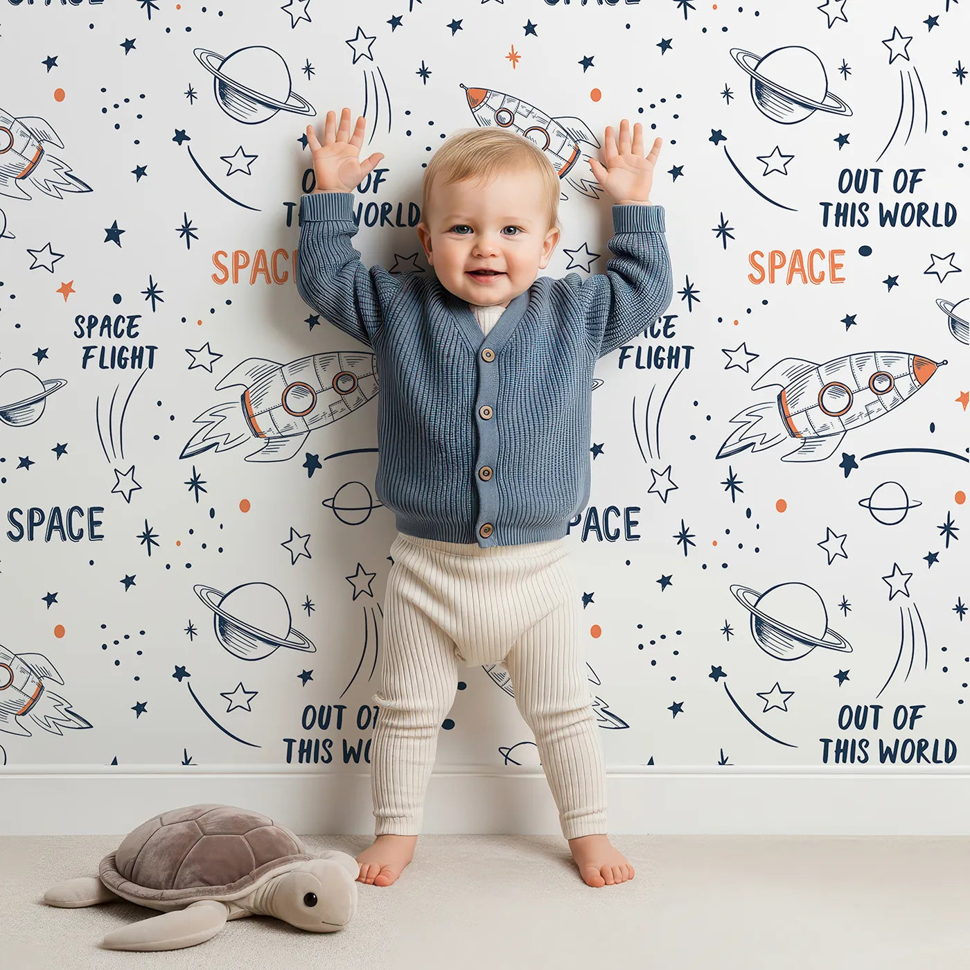 Lovely child standing in front of Whimsy Tots Rocket Doodle Space Flight Wallpaper