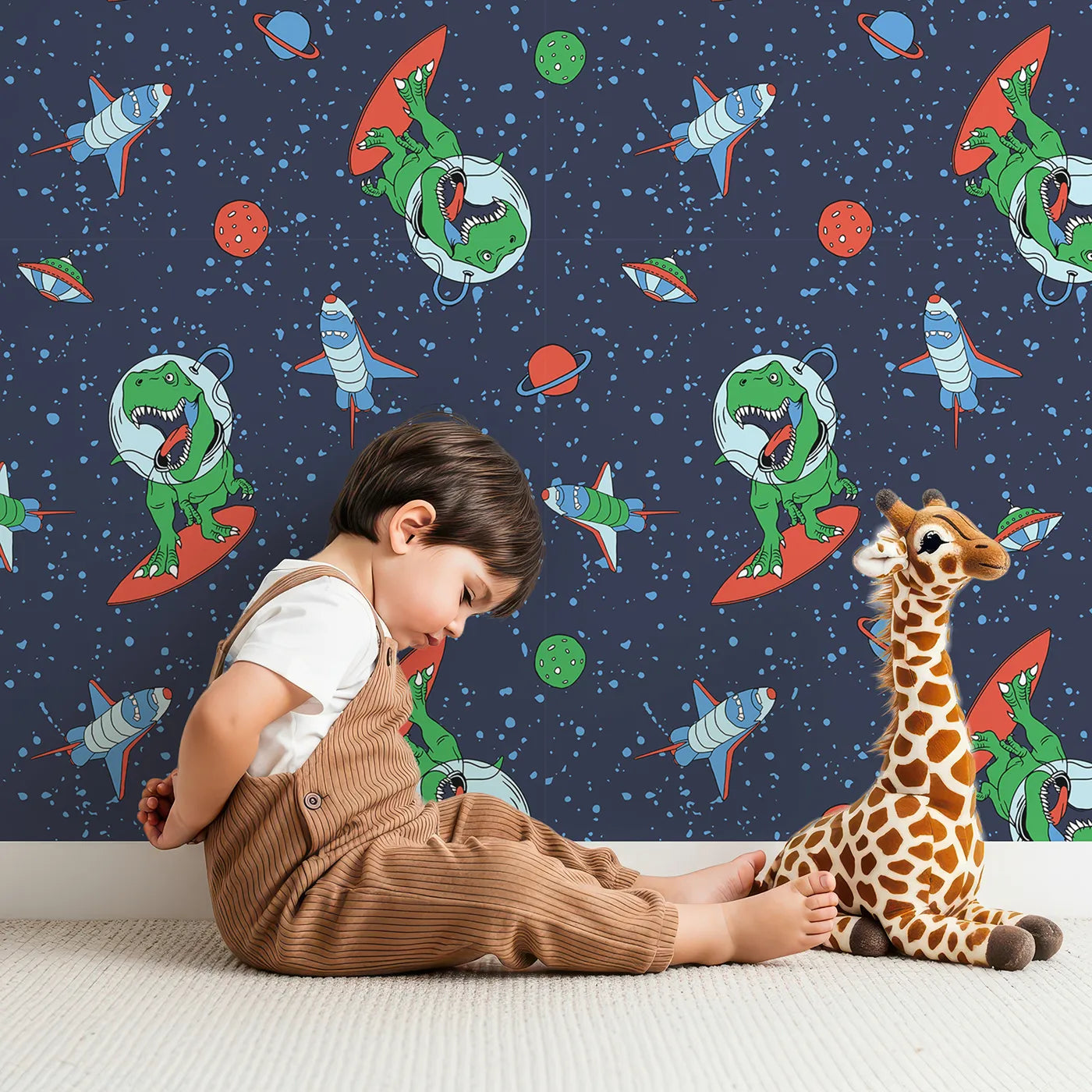 Lovely child standing in front of Whimsy Tots Dino Space Surfer Wallpaper with dinosaur, t-rex, space, rocket, surf in design.