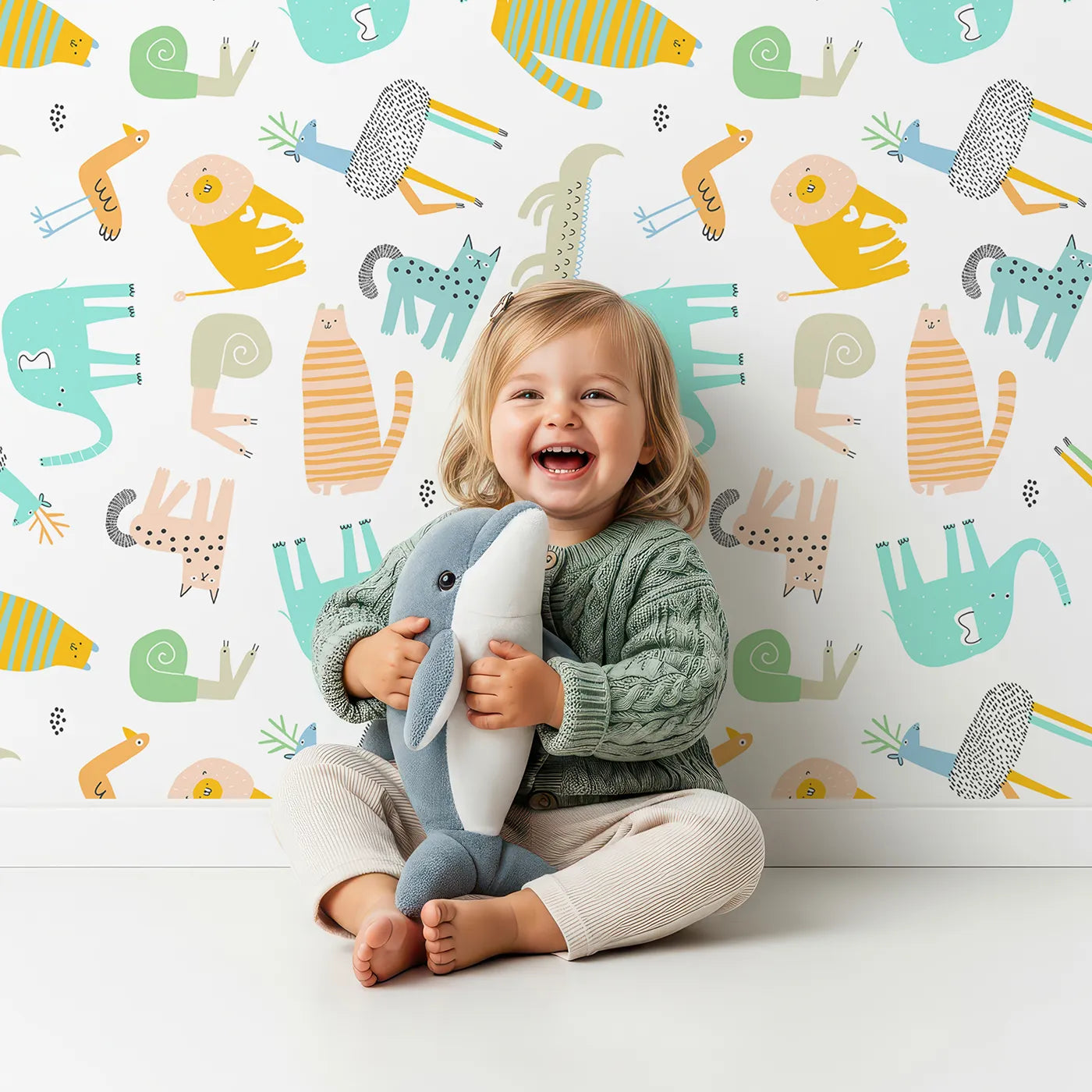 Lovely child standing in front of Whimsy Tots Quirky Animal Kingdom Wallpaper with animal, abstract, modern, quirky, safari in design.