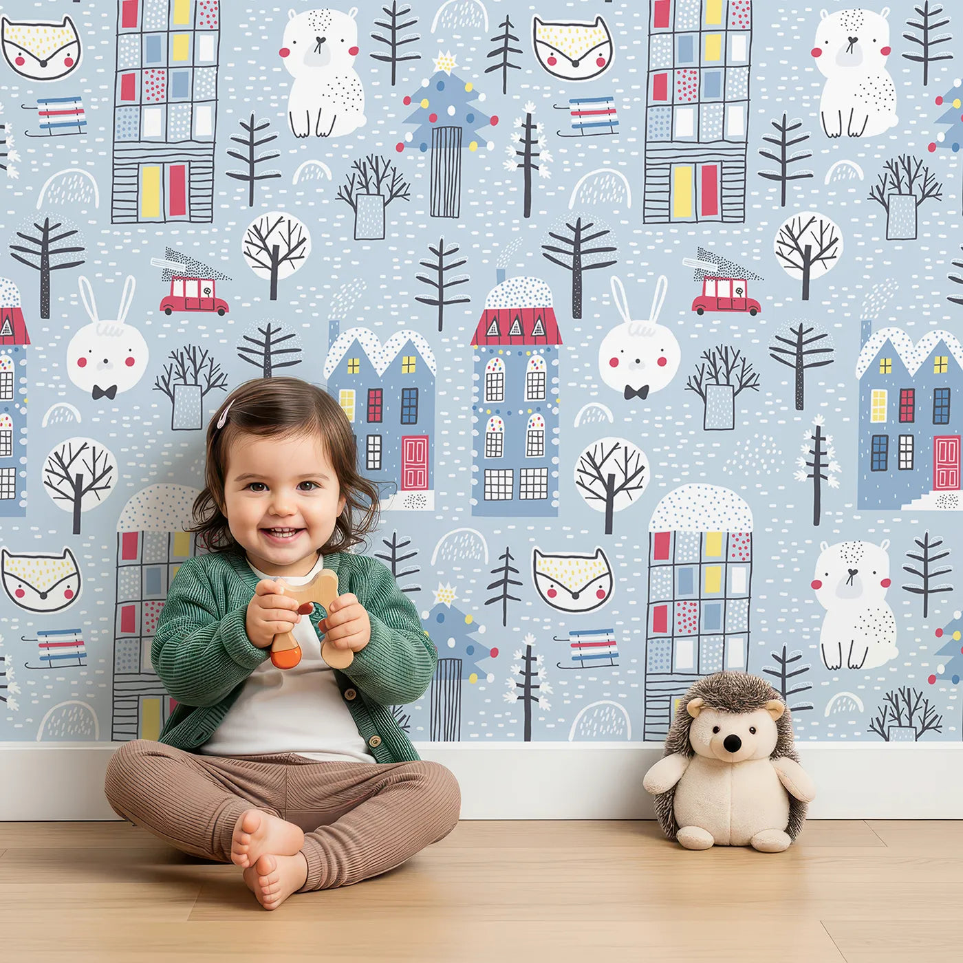 Lovely child standing in front of Whimsy Tots Cozy Winter Village Wallpaper with winter, village, house, animal, snow in design.