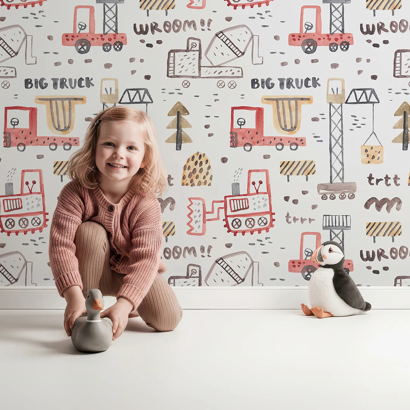 Lovely child standing in front of Whimsy Tots Watercolor Big Truck Zone Wallpaper with construction, truck, watercolor, crane, big truck in design.