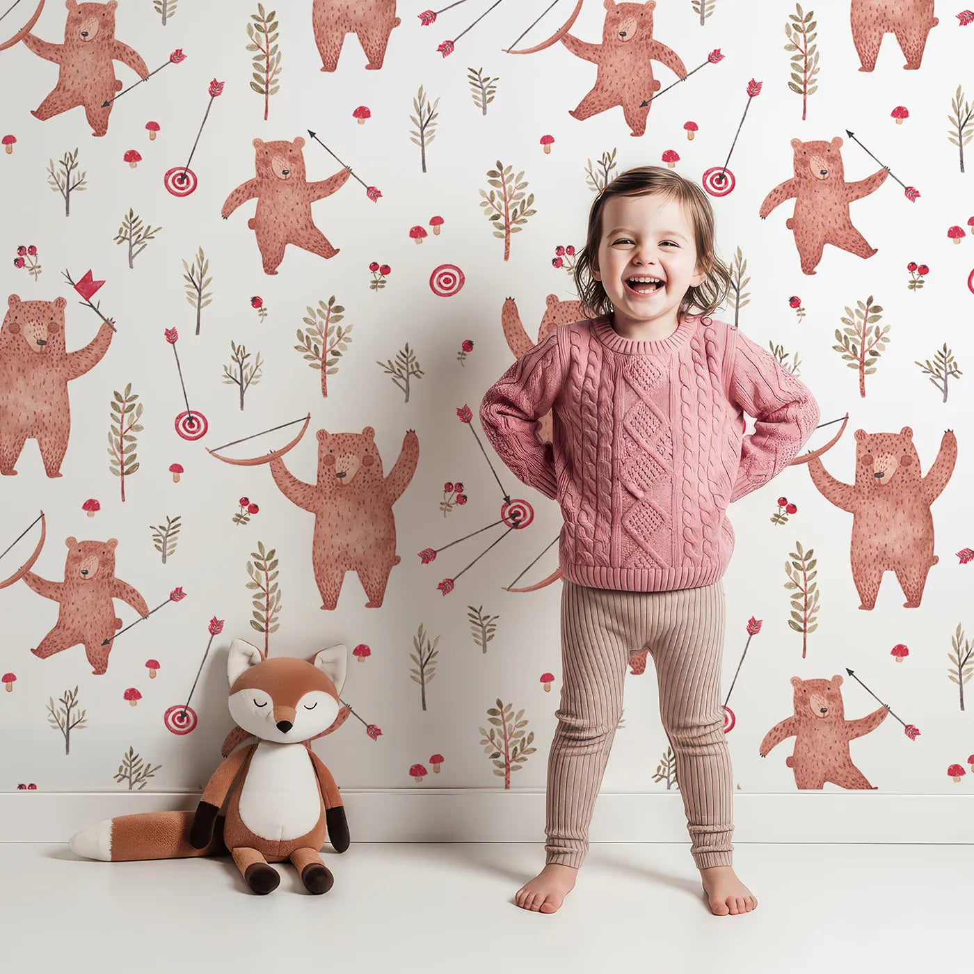Lovely child standing in front of Whimsy Tots Woodland Archer Bear Wallpaper with bear, arrow, archery, woodland, watercolor in design.