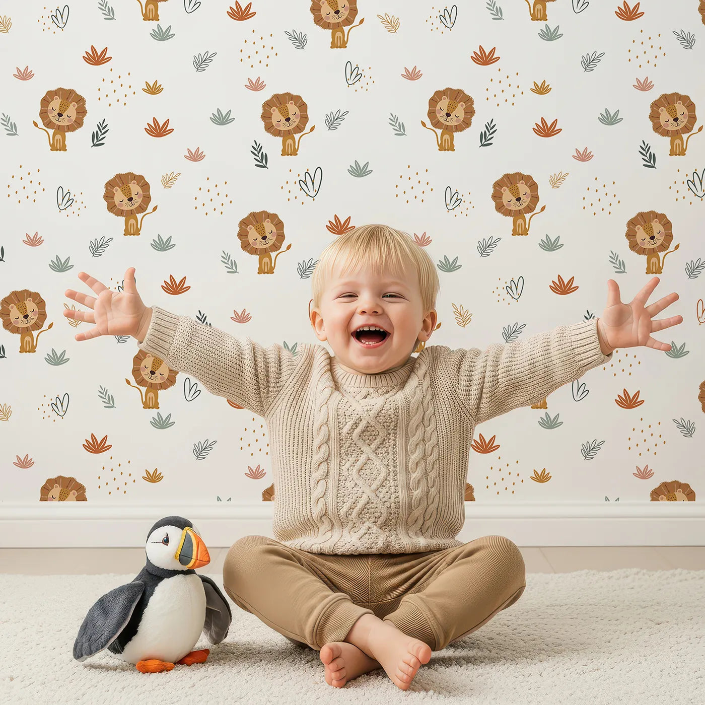 Lovely child standing in front of Whimsy Tots Boho Lion and Leaves Wallpaper with lion, boho, leaf, botanical, safari in design.