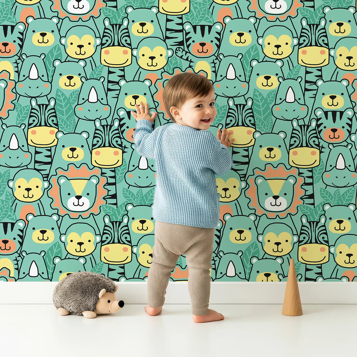 Lovely child standing in front of Whimsy Tots Jungle Friends Portrait Wallpaper with safari, jungle, animal, face, lion in design.