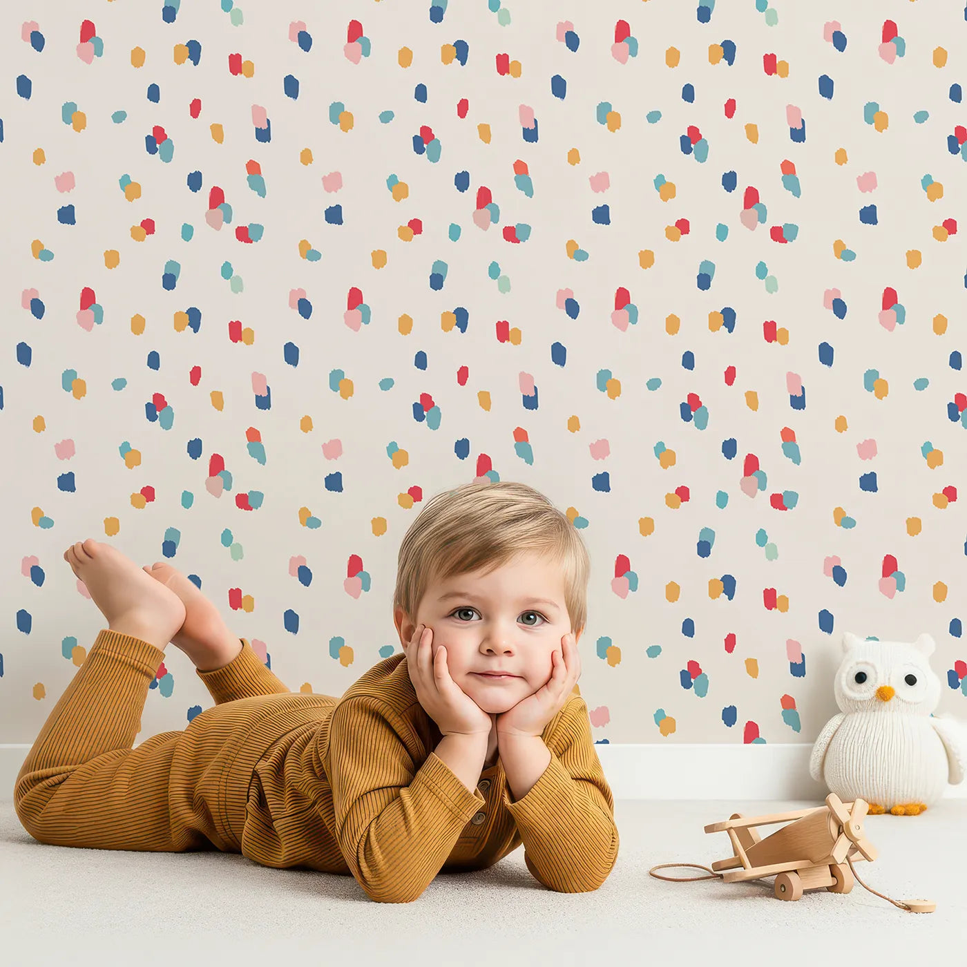 Lovely child standing in front of Whimsy Tots Abstract Confetti Dots Wallpaper with confetti, dot, abstract, colorful, painted in design.