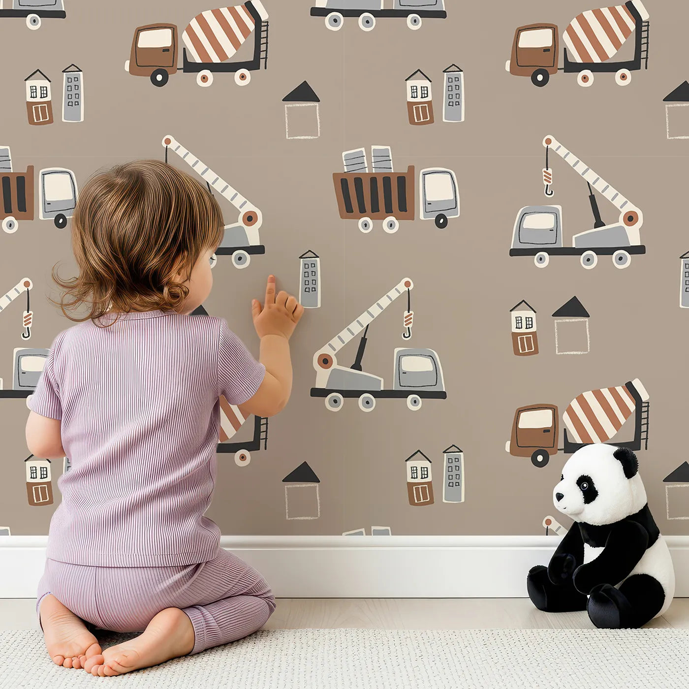 Lovely child standing in front of Whimsy Tots Neutral Construction Crew Wallpaper with construction, truck, crane, modern, neutral in design.