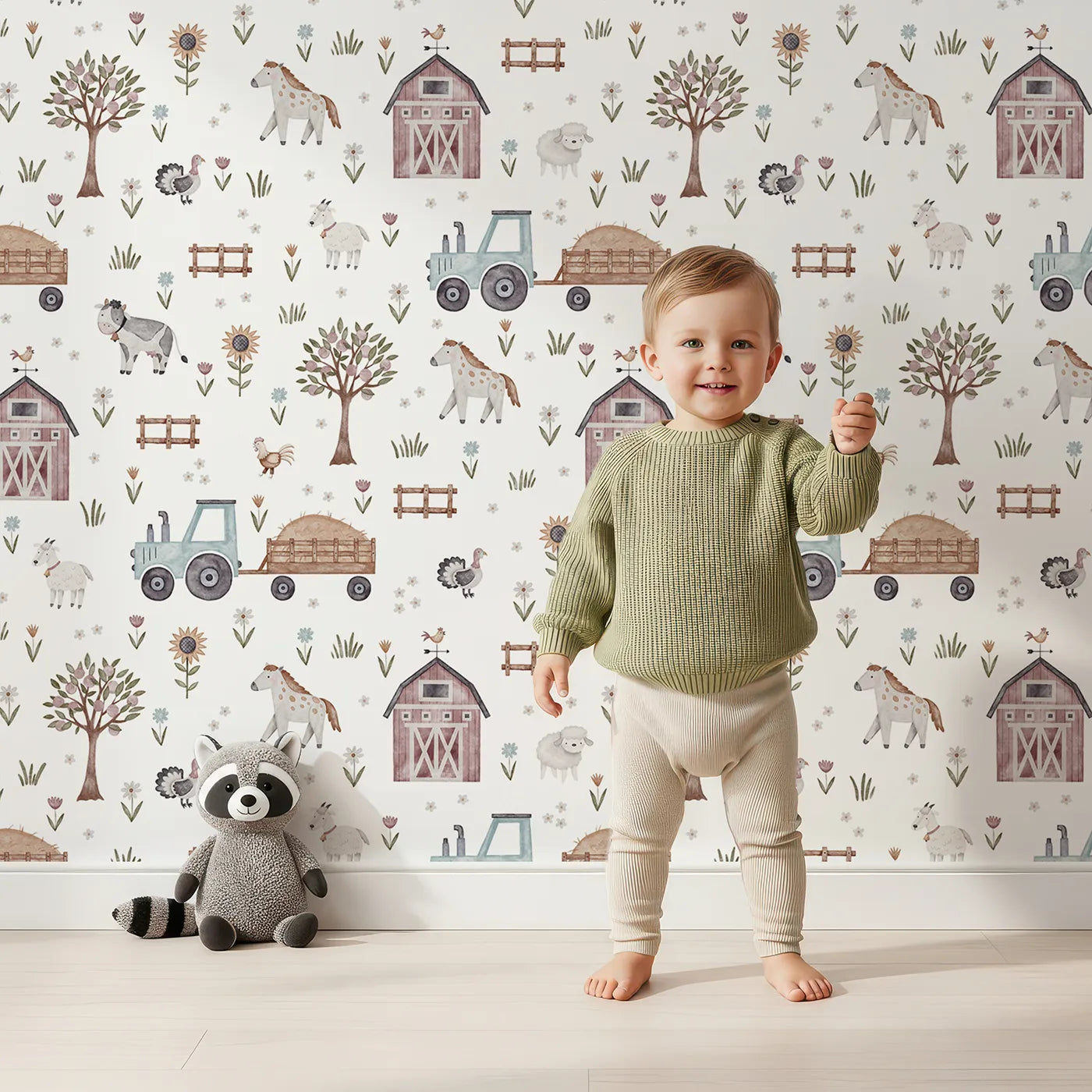 Lovely child standing in front of Whimsy Tots Watercolor Country Farm Life Wallpaper with farm, animal, tractor, barn, horse in design.