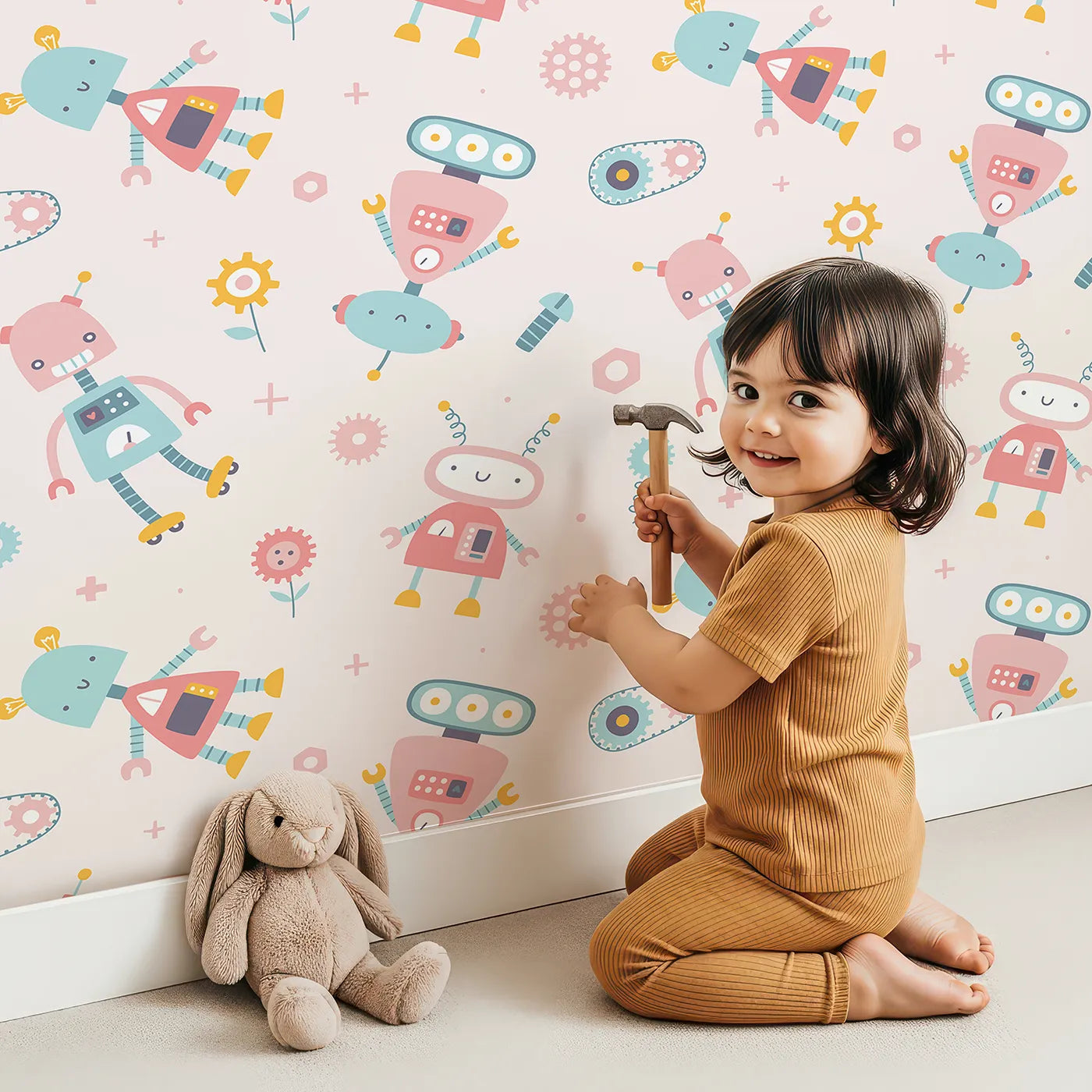 Lovely child standing in front of Whimsy Tots Pastel Robot Pals Wallpaper with robot, cute, pastel, gear, science in design.