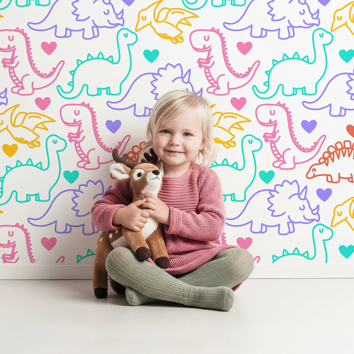 Lovely child standing in front of Whimsy Tots Neon Dino Love Wallpaper with dinosaur, neon, outline, colorful, heart in design.