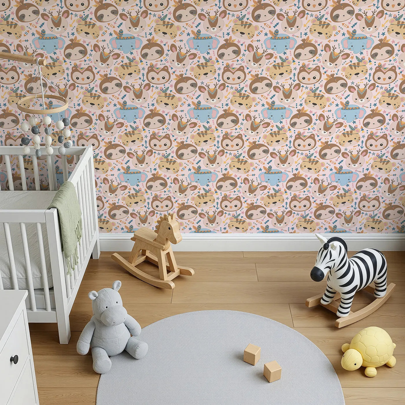 Top-Down view of Whimsy Tots' Wild Whimsy Tribe Wallpaper in Pink (W3012B).A joyful mix of animal faces, feathers, and arrows creates a world of wonder.