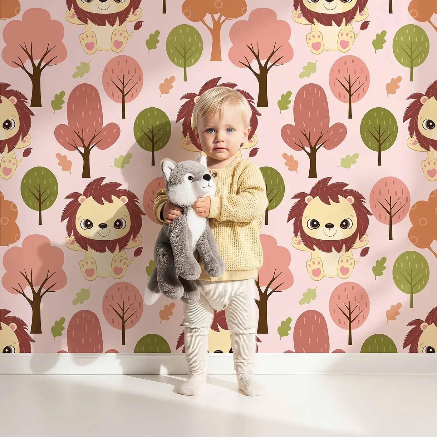 Lovely child standing in front of Whimsy Tots Autumn Safari Stroll Wallpaper in Pink with lion, tree, leaf in design.