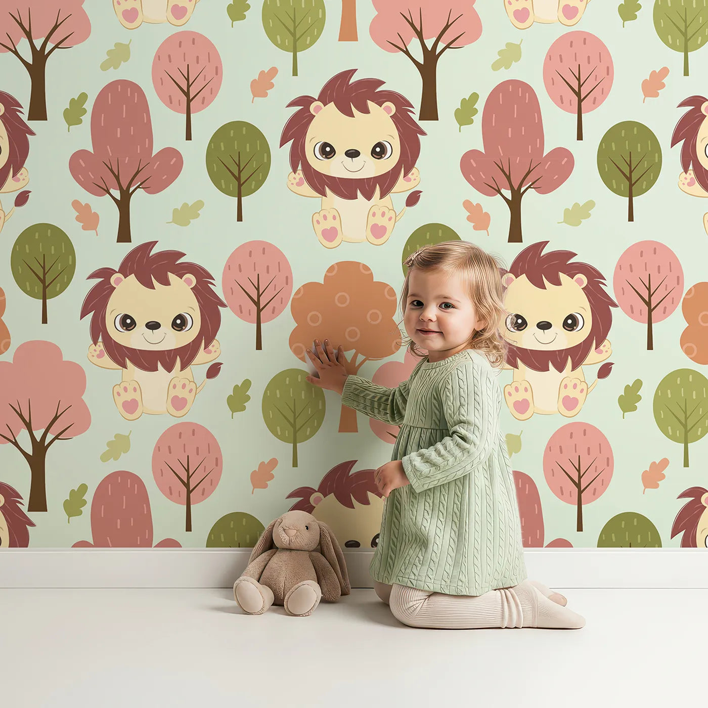 Lovely child standing in front of Whimsy Tots Autumn Safari Stroll Wallpaper in Mint Green with lion, tree, leaf in design.