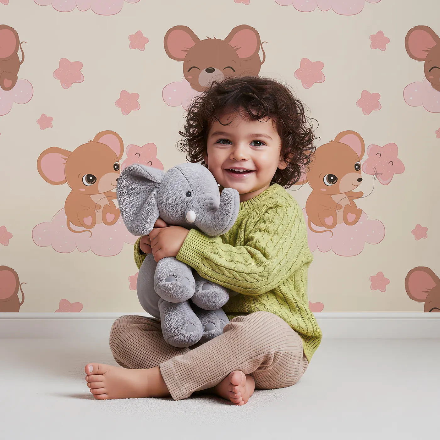 Lovely child standing in front of Whimsy Tots Starry Cloud Mouse Wallpaper in Cream with mouse, cloud, balloon, star in design.