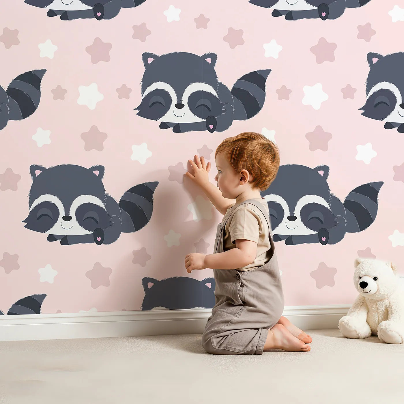 Lovely child standing in front of Whimsy Tots Raccoon Dream Stars Wallpaper in Pink with raccoon, star in design.
