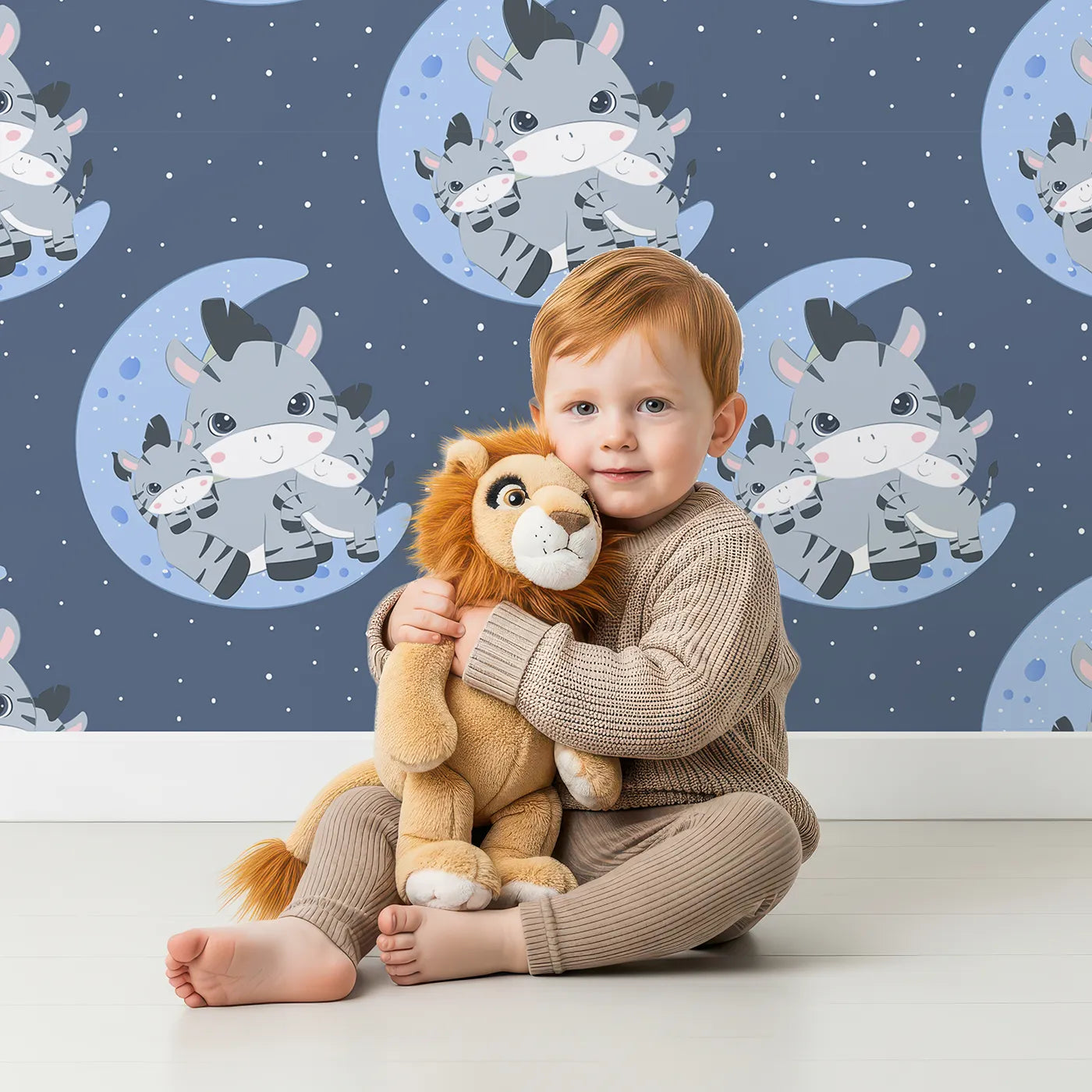 Lovely child standing in front of Whimsy Tots Moon Cuddles Zebra Wallpaper in Steel Blue with zebra, moon, star in design.