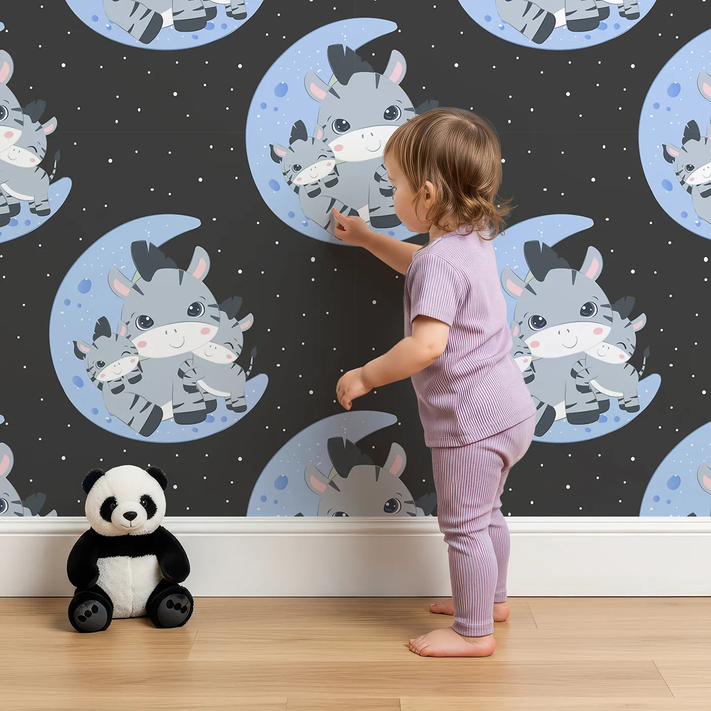 Lovely child standing in front of Whimsy Tots Moon Cuddles Zebra Wallpaper in Lavender with zebra, moon, star in design.