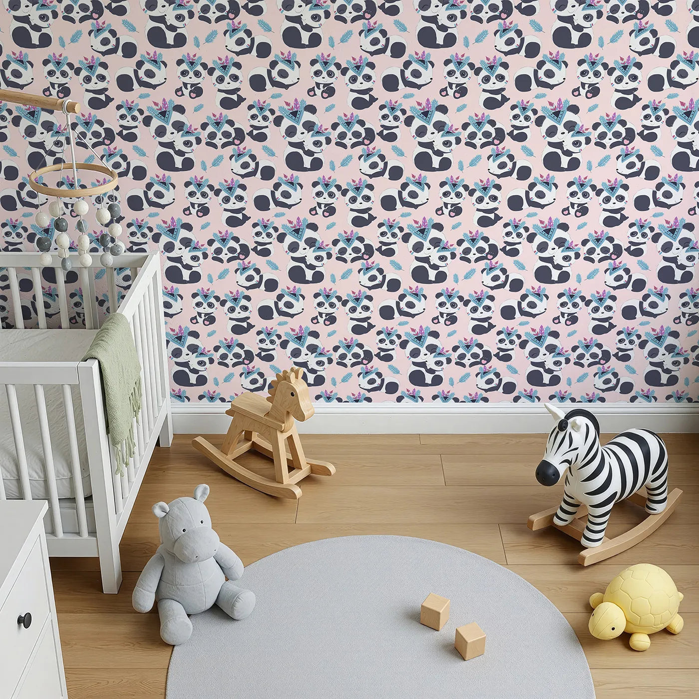 Top-Down view of Whimsy Tots' Tribal Hug Panda Wallpaper in Pink (W3040B).Adventurous pandas share hugs beneath floating feathers on a blush-pink field.