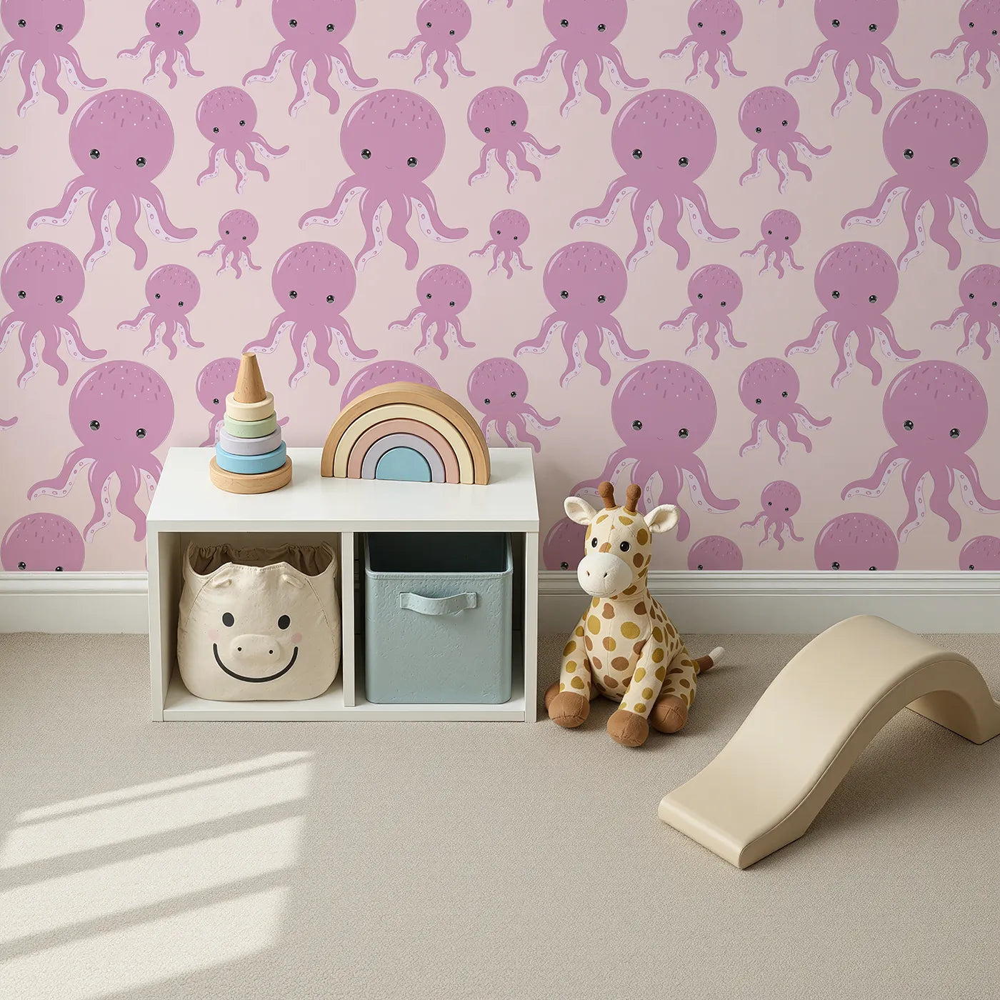 Top-Down view of Whimsy Tots' Ocean Bubbles Octopus Wallpaper in Blush Pink (W3041B).Smiling pink octopuses float gently across a rosy sea of calm.
