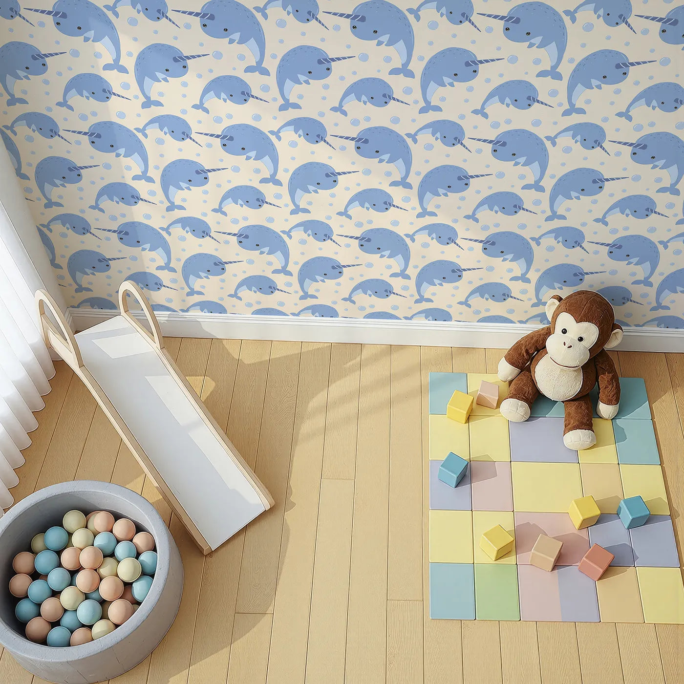 Top-Down view of Whimsy Tots' Bubbly Narwhal Parade Wallpaper in Beige (W3042C).Smiling narwhals and floating bubbles dance across a soft sandy sea.