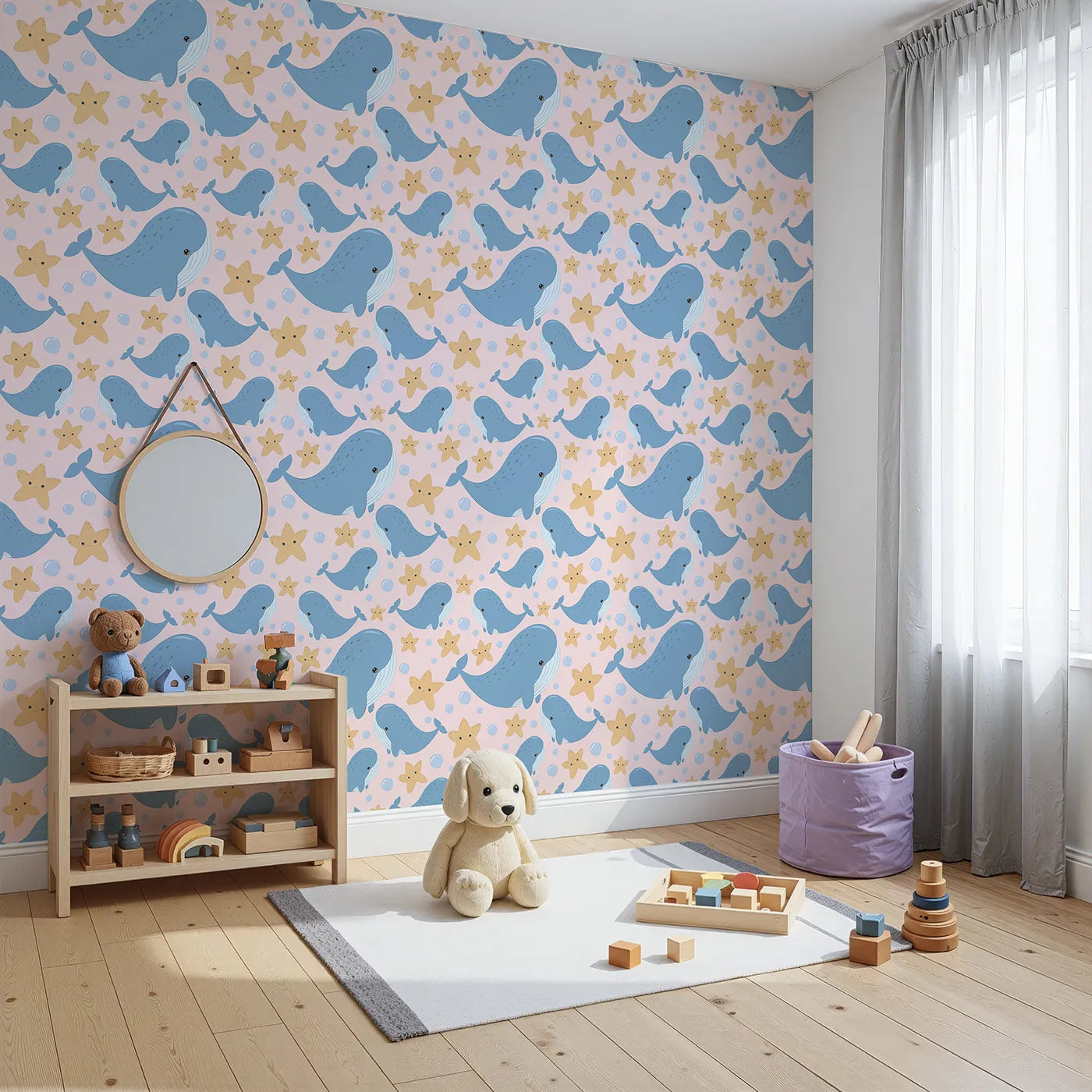 Angled view of Whimsy Tots' Starry Whale Friends Wallpaper in Blush Pink (W3044B).Sweet whales and sunny stars swim across soft pink seas.