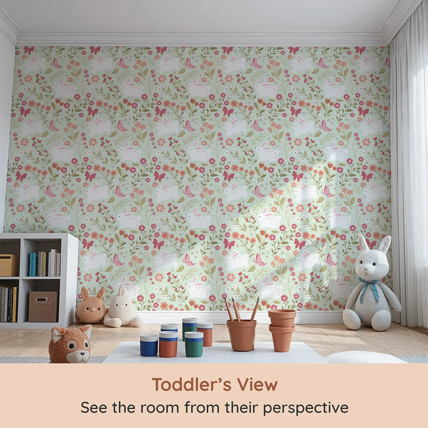 Whimsy Tots Meadow Hops Bunny Wallpaper in Mint Green (W3047C) from your child's view.Bunnies bloom with joy among minty leaves and cheerful petals.