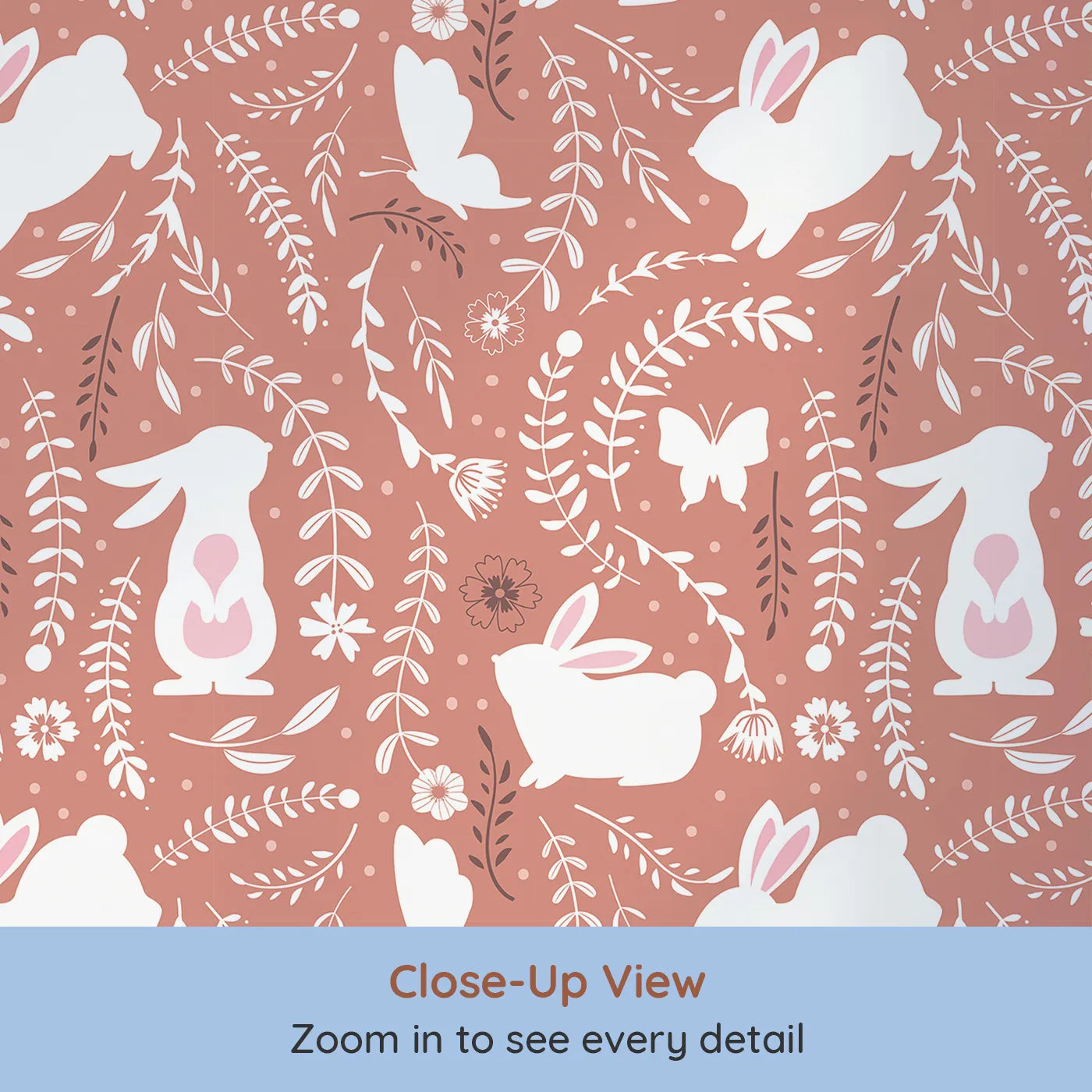 Close-up view of Whimsy Tots' Bunny Hideaway Meadow Wallpaper in Terracotta Brown (W3050A).White bunnies and dancing florals curl through warm terracotta vines.