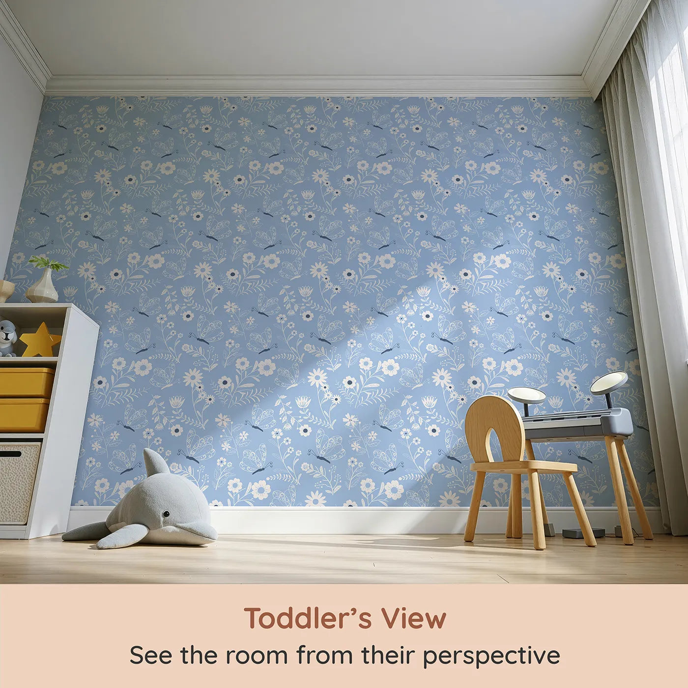 Whimsy Tots Floral Flutter Butterfly Wallpaper in Powder Blue (W3056B) from your child's view.Curly butterflies and sketchy florals bloom on a soft powder blue field.